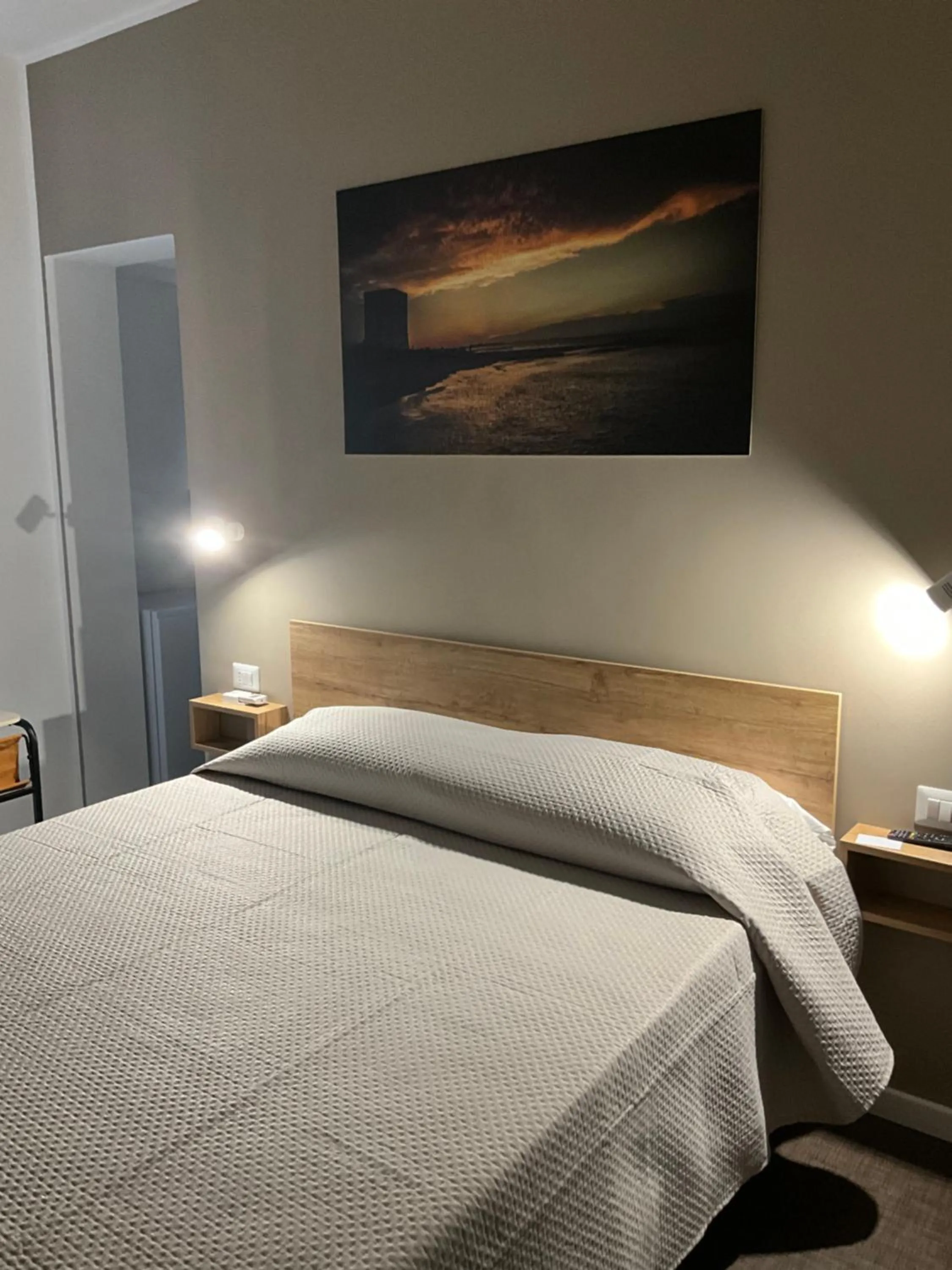 Bed in M&M rooms Margherita di Savoia