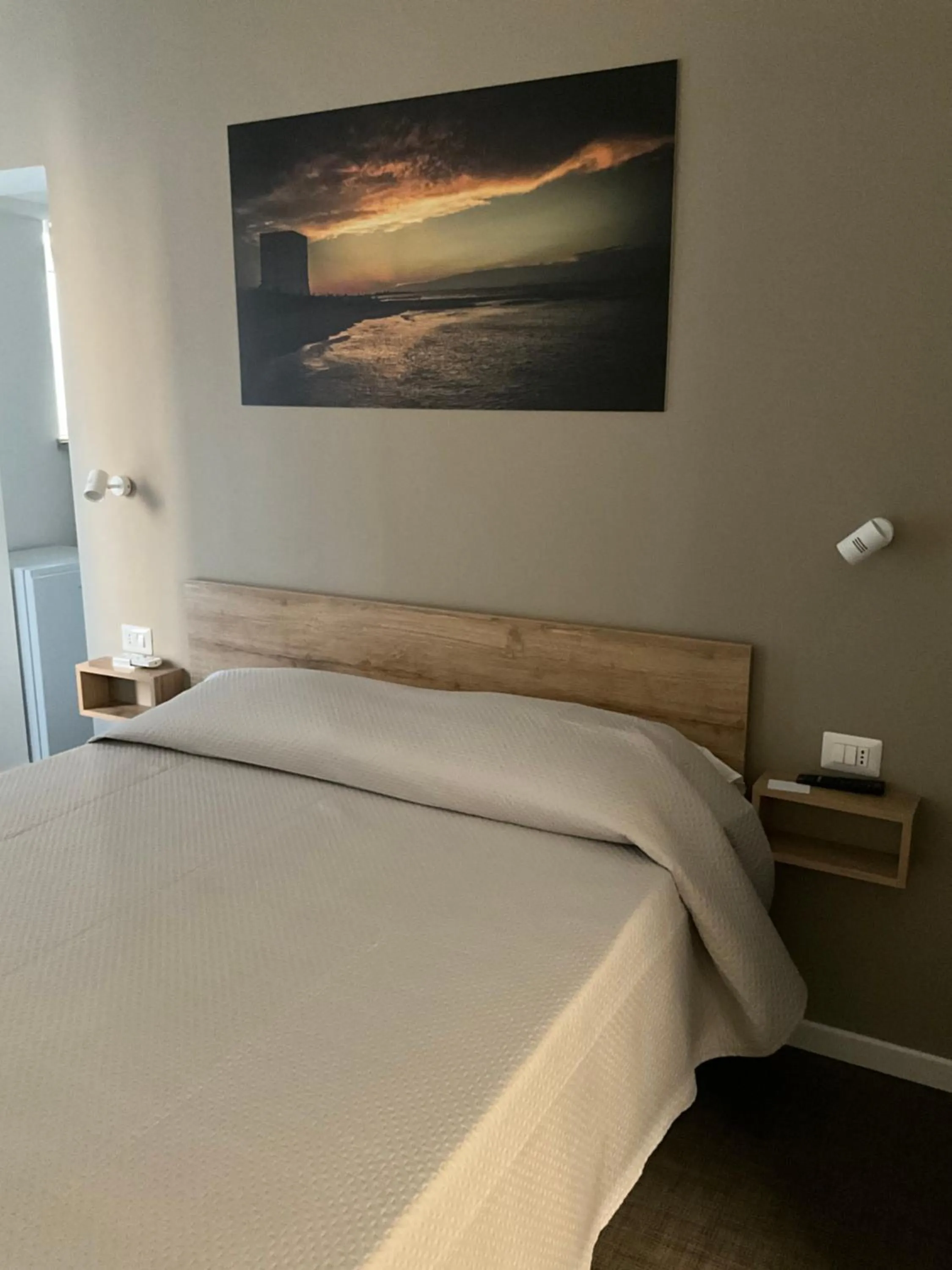 Bed in M&M rooms Margherita di Savoia