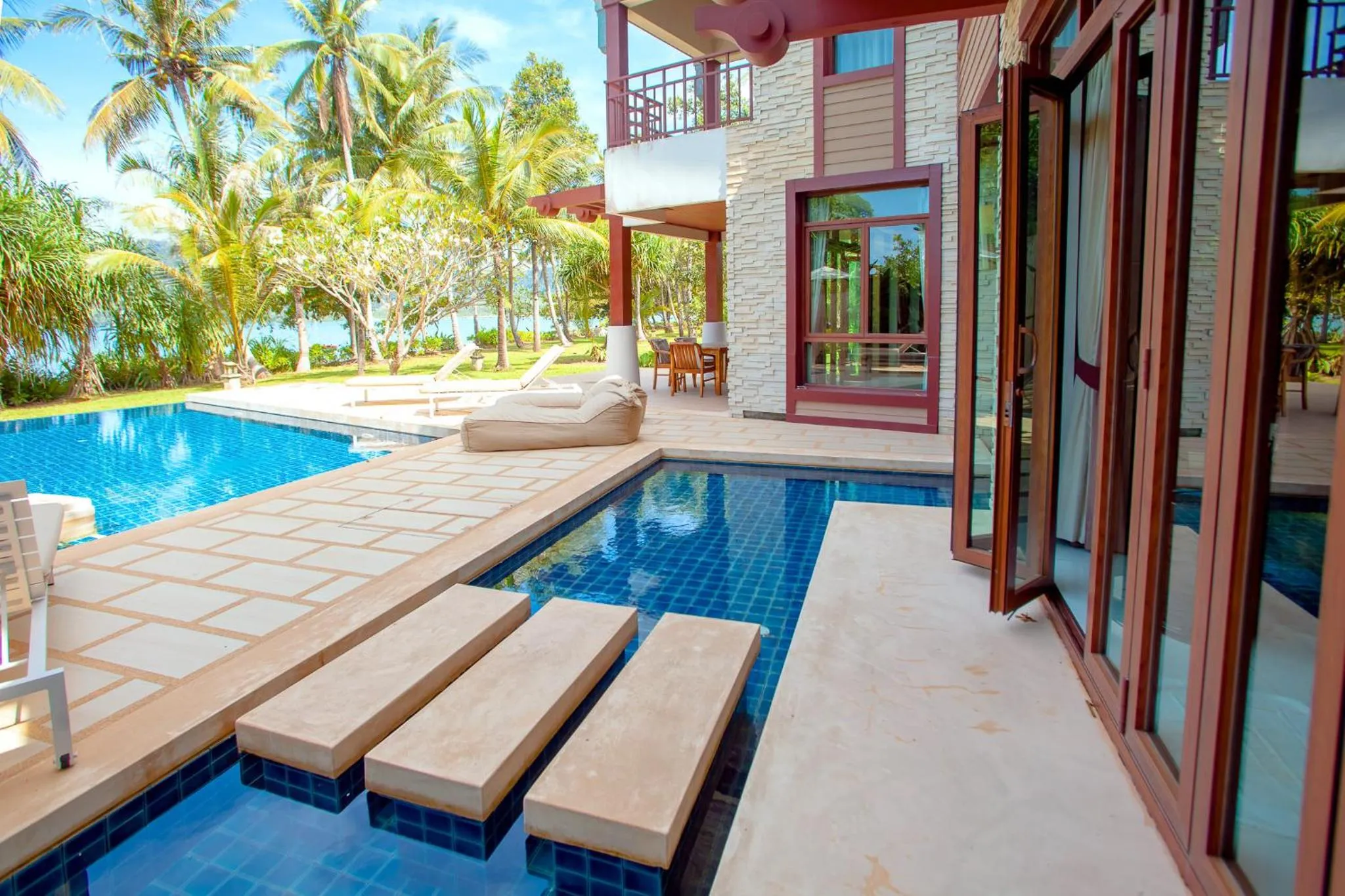 Swimming pool in Amatapura Beachfront Villa 1, SHA Certified