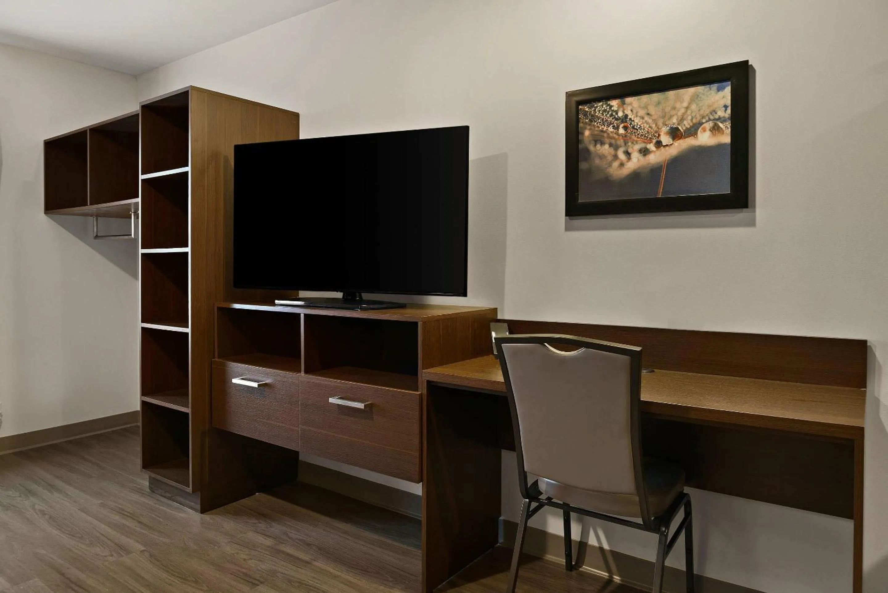 Bedroom in WoodSpring Suites East Lansing - University Area