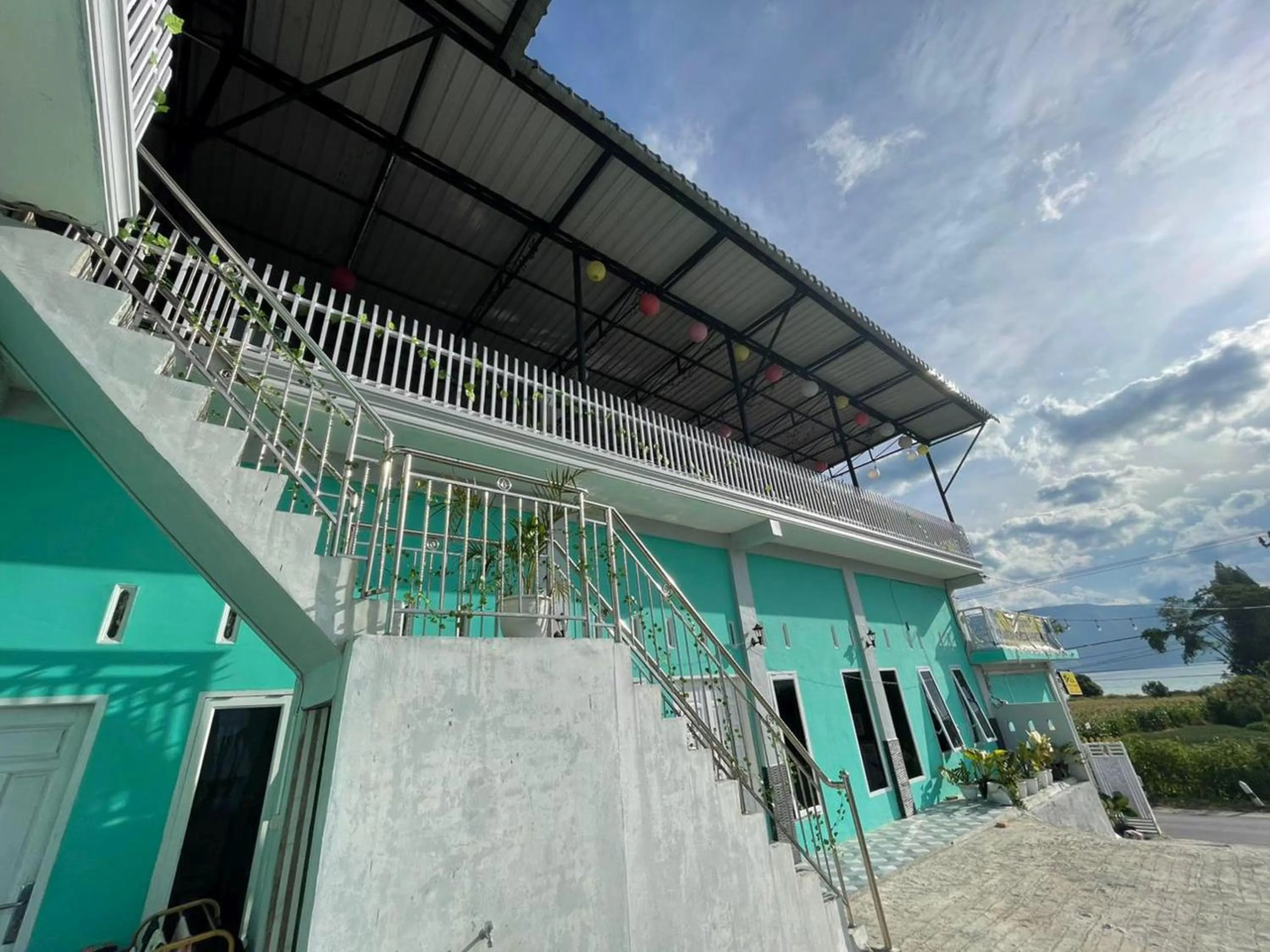 Balcony/Terrace in Antony Homestay near Pantai Pasir Putih Parbaba Mitra RedDoorz