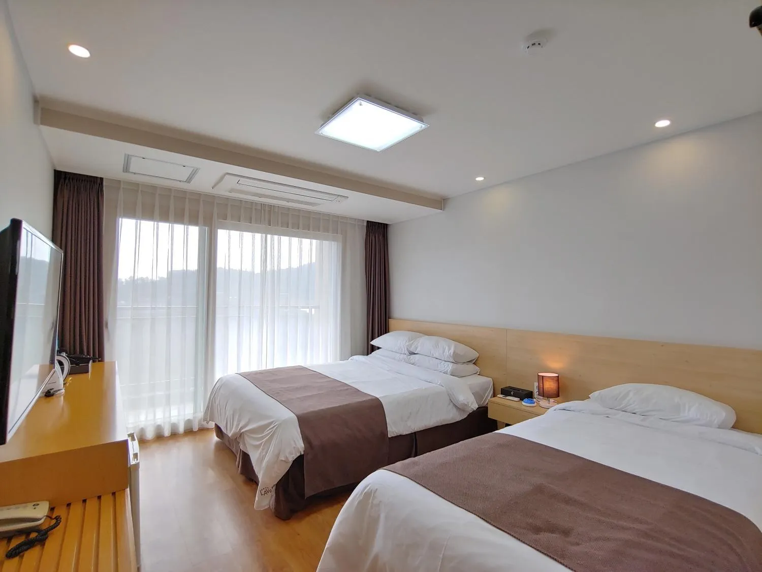 Bed in Jeju Lavender Hotel