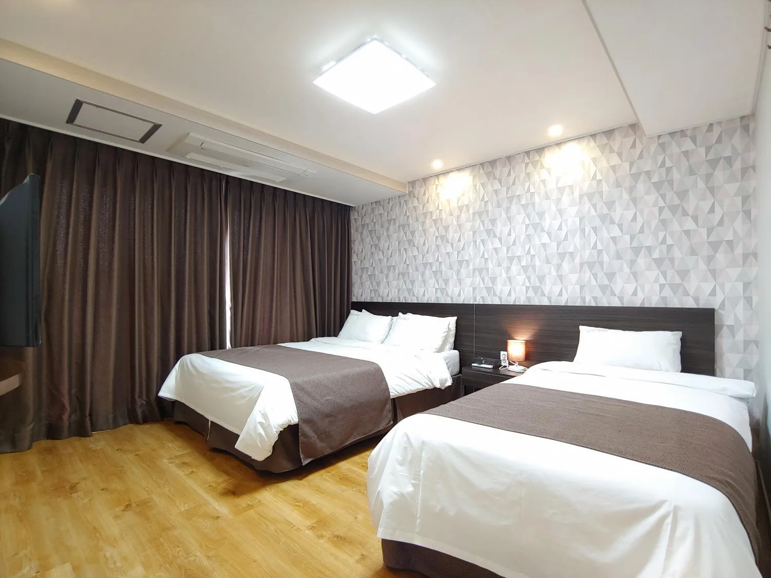 Bed in Jeju Lavender Hotel