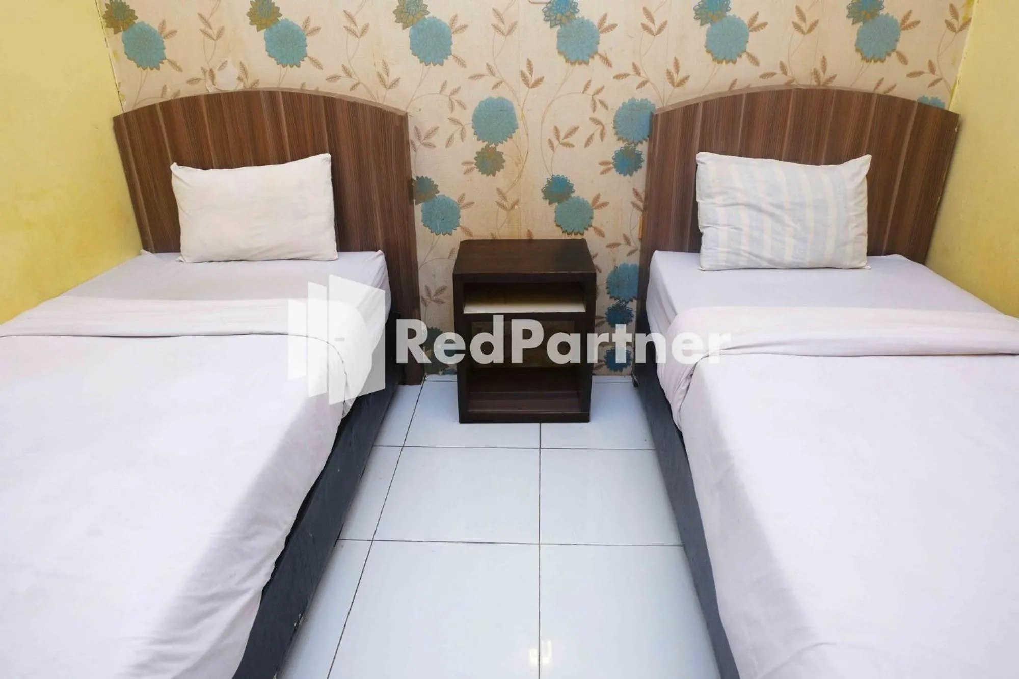 Bed in Hotel Permata Makassar Mitra RedDoorz