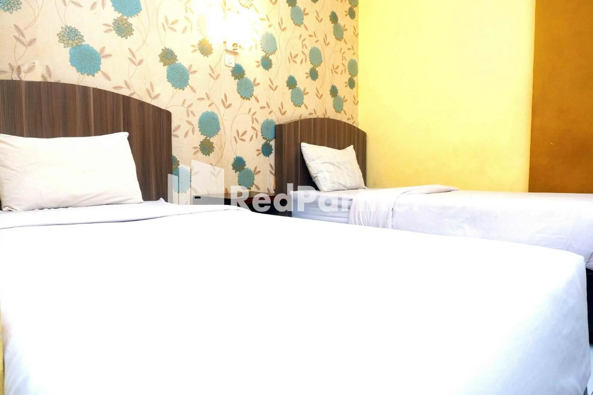 Bed in Hotel Permata Makassar Mitra RedDoorz