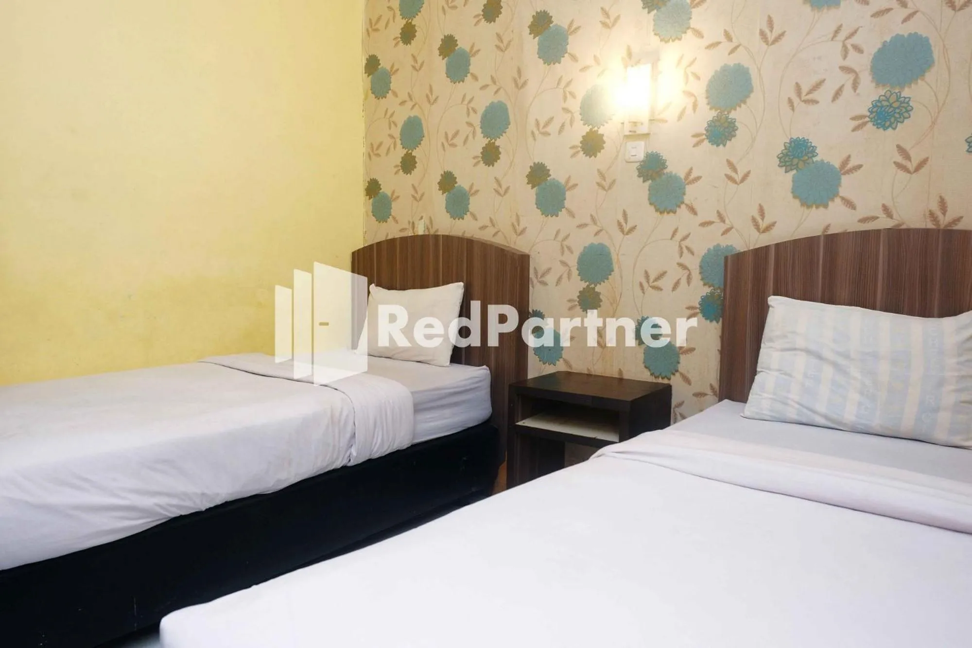 Bed in Hotel Permata Makassar Mitra RedDoorz