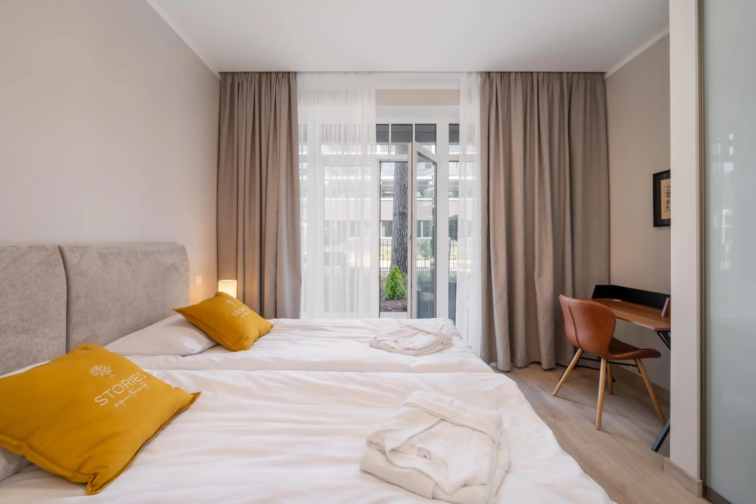 Bed in STORIES Design ApartHotel