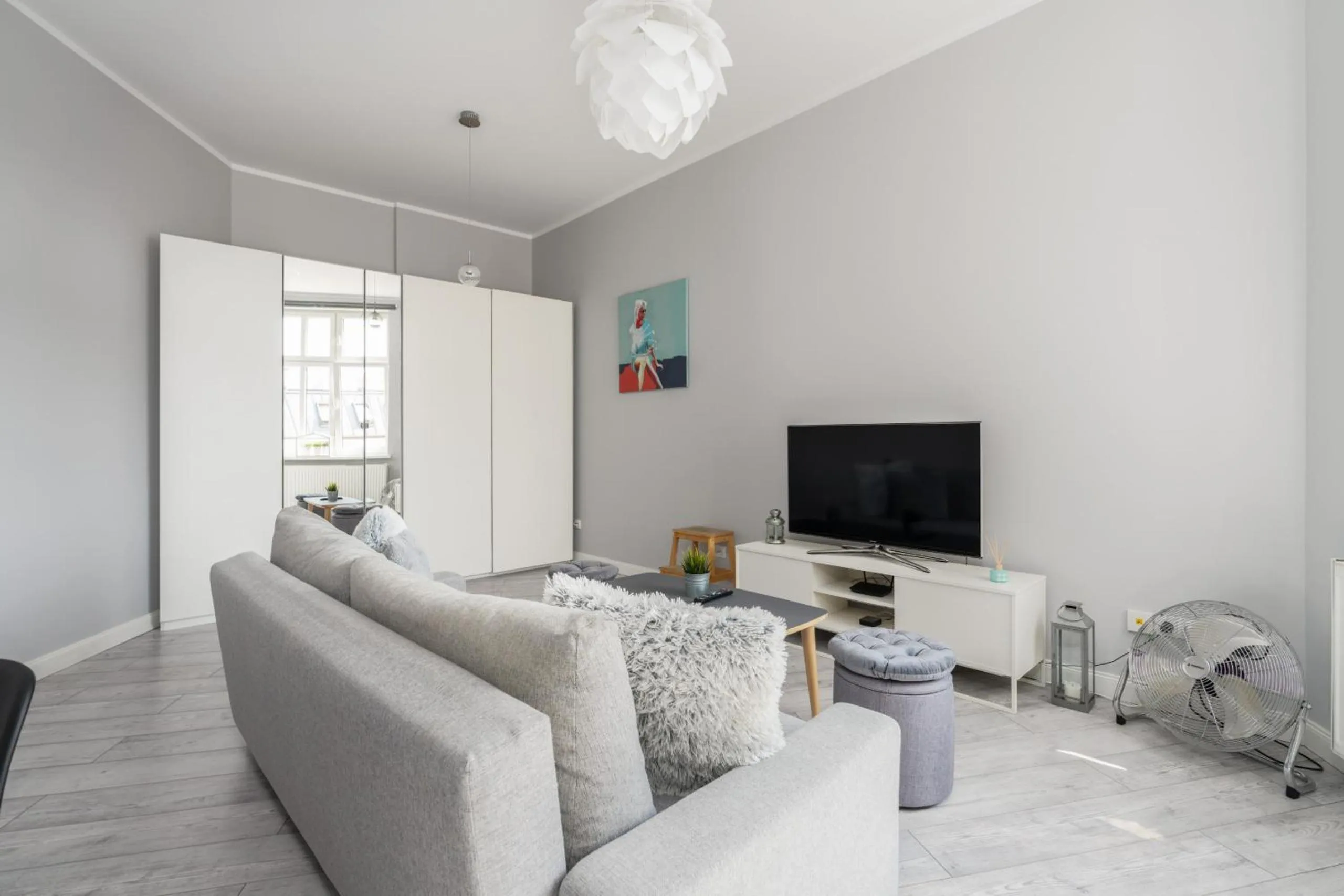 Communal lounge/ TV room in Scandi Małe Garbary Apartment Piaskowa near Old Market Square by Noclegi Renters