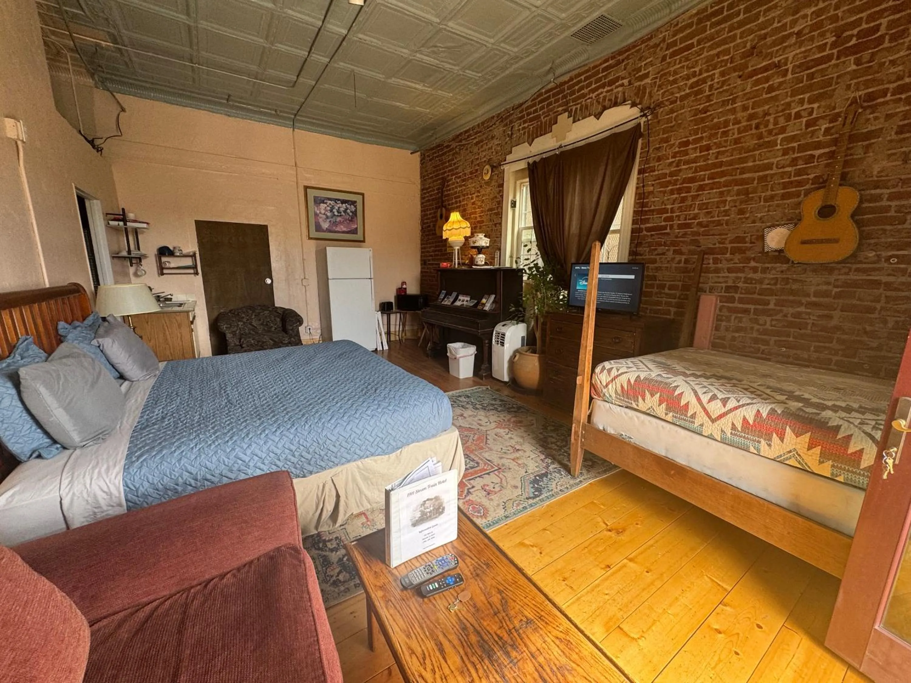Living room, Bed in Steam Train Hotel