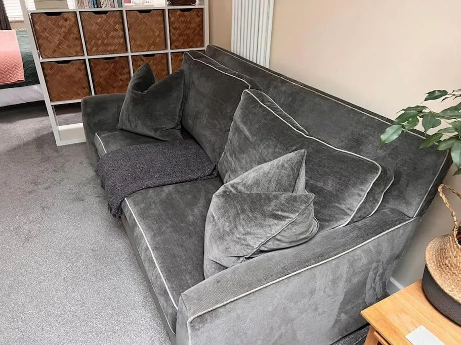 Living room in Cute Studio with kitchen, patio and free parking