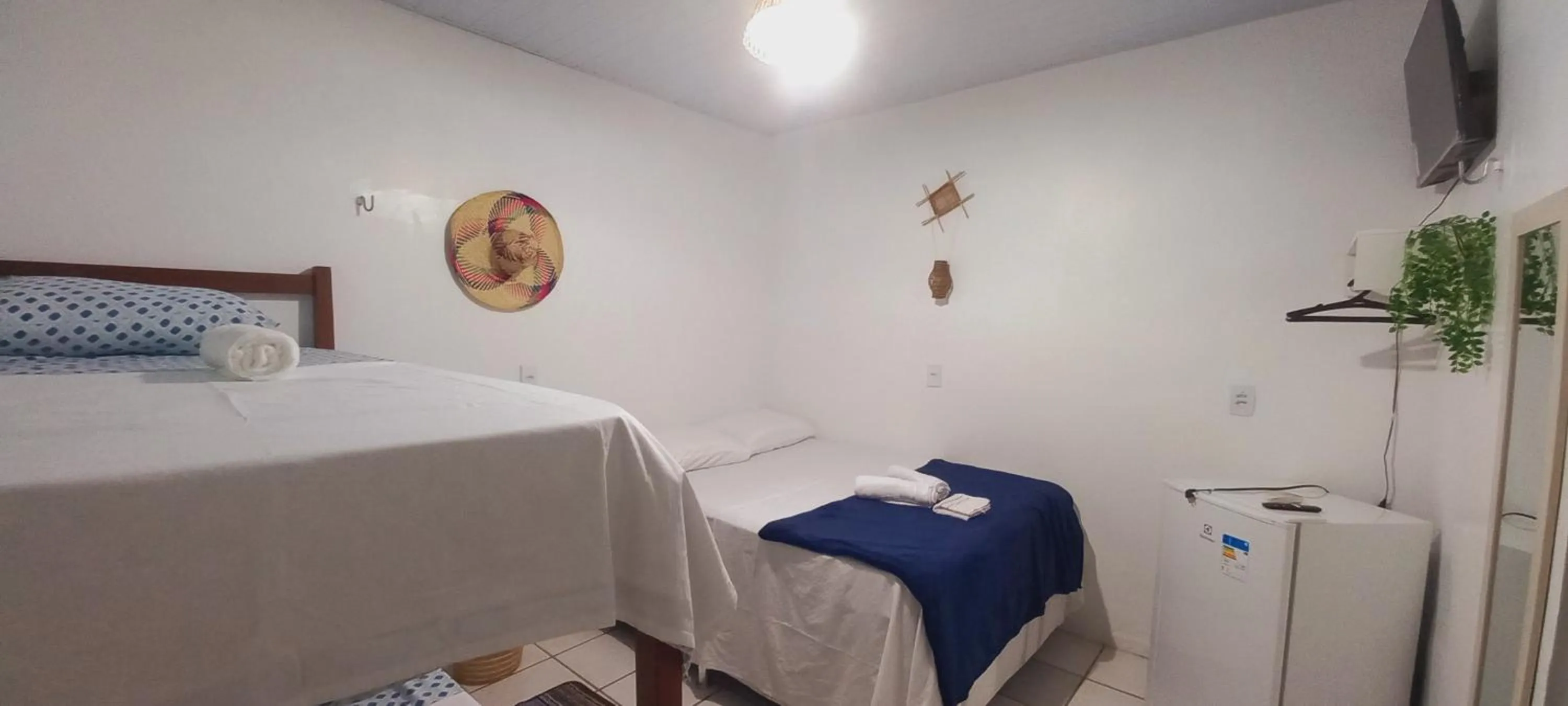 Bed in Pousada Angatu alter