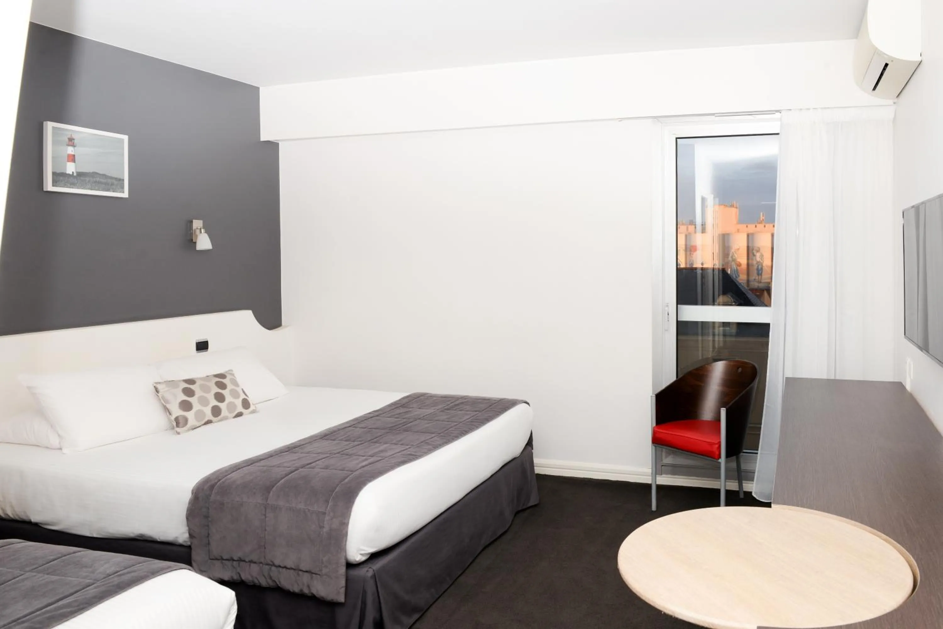 Photo of the whole room, Bed in Kyriad Prestige Les Sables d'Olonne - Plage - Centre des Congrès