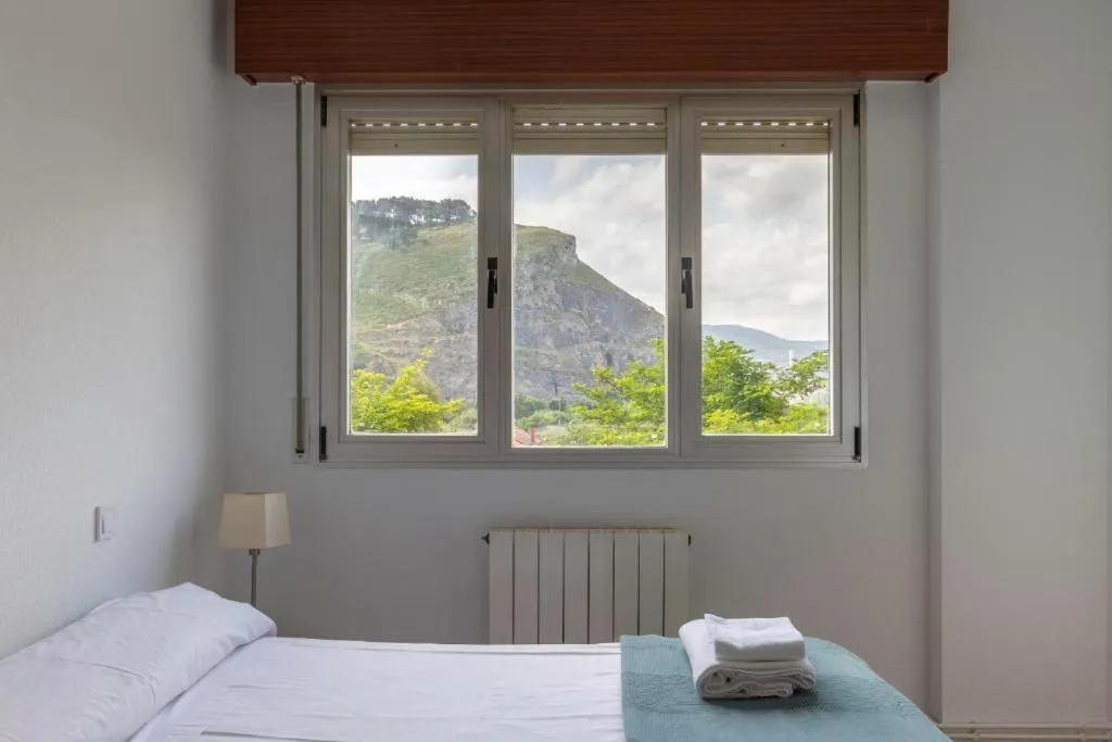 Bed in La Arena Apartamentos Zierbena