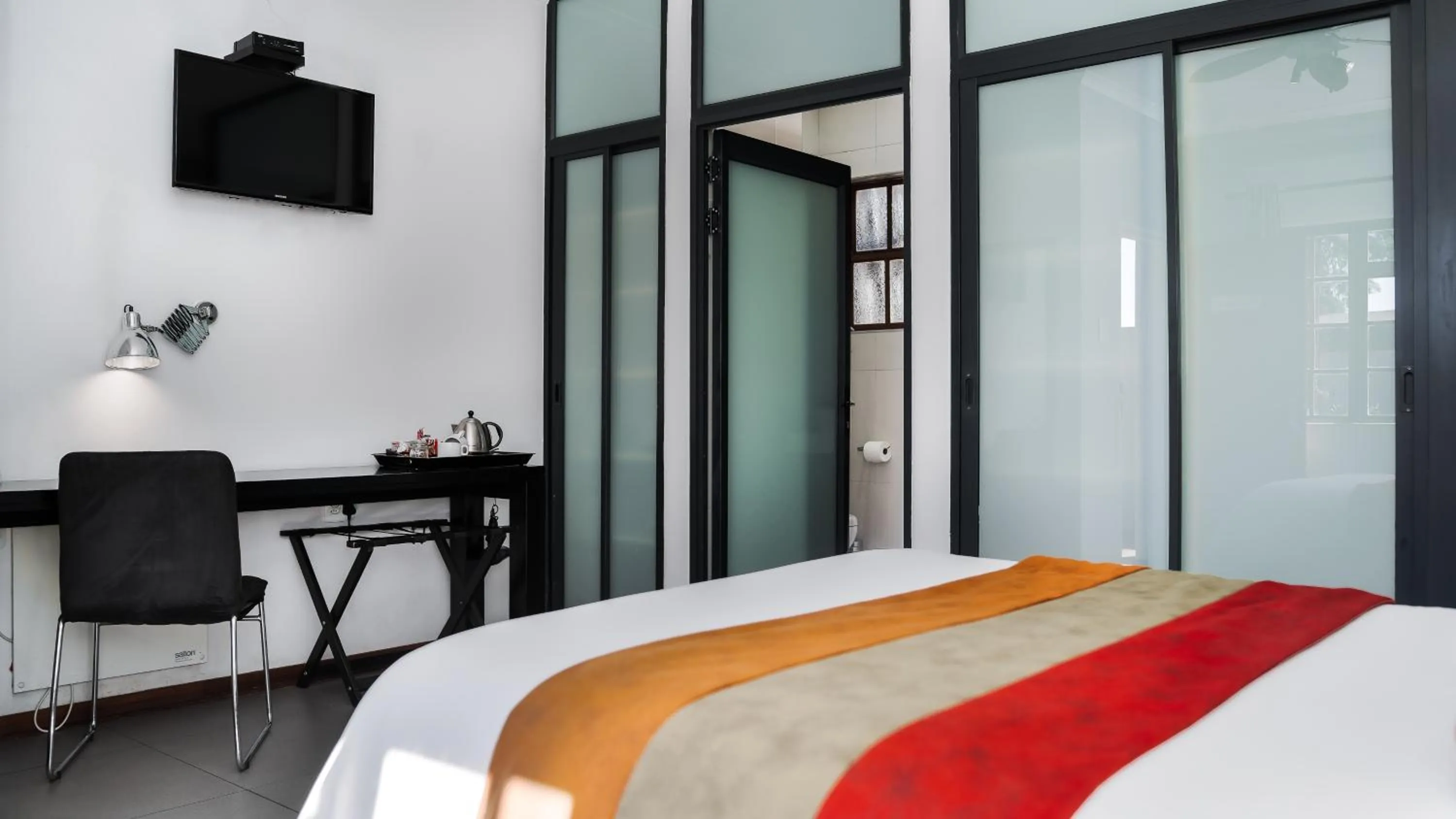 Bed in Yalla Yalla Boutique Hotel