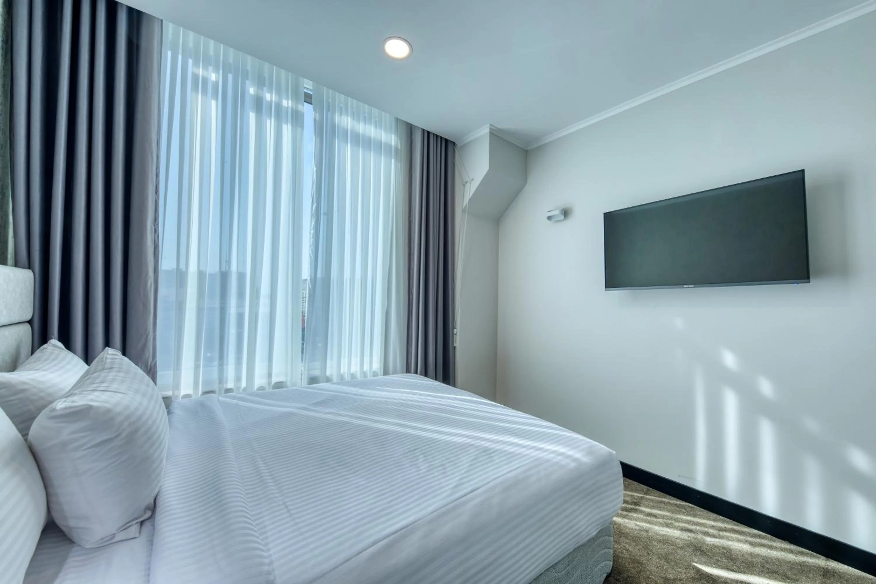 Bed in Expocore Hotel