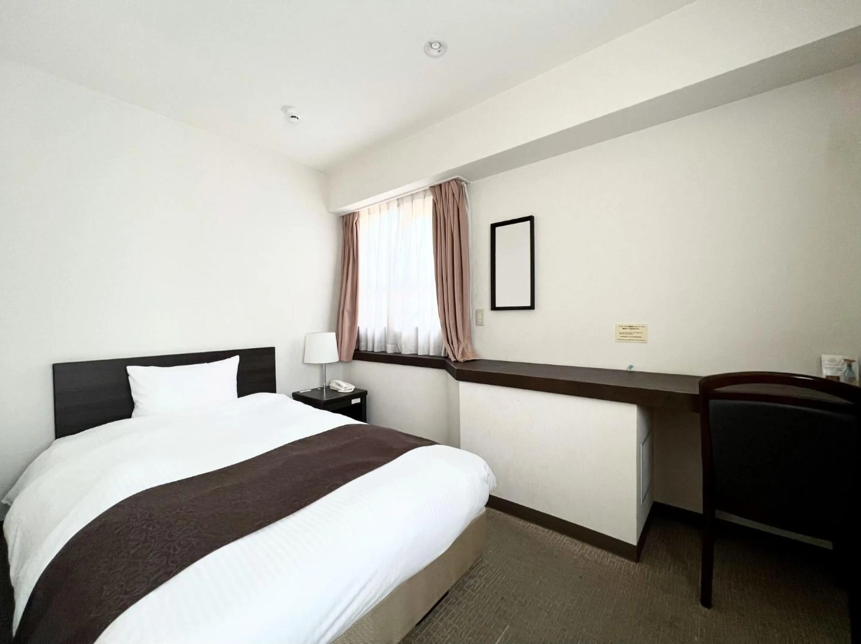 Bed in Shinjuku Sun Park Hotel