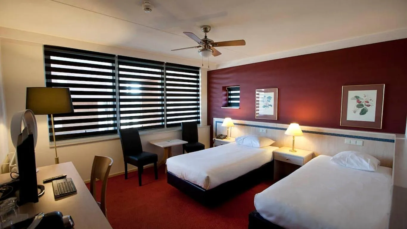 Bed in City Hotel Restaurant Stadskanaal