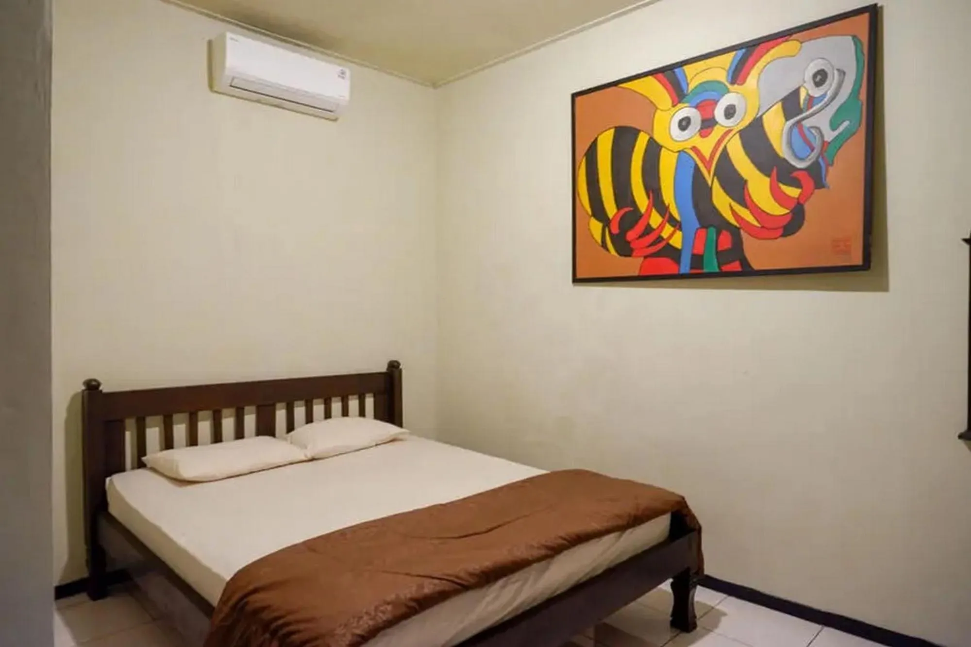 Bed in Cakra Homestay Solo Mitra RedDoorz