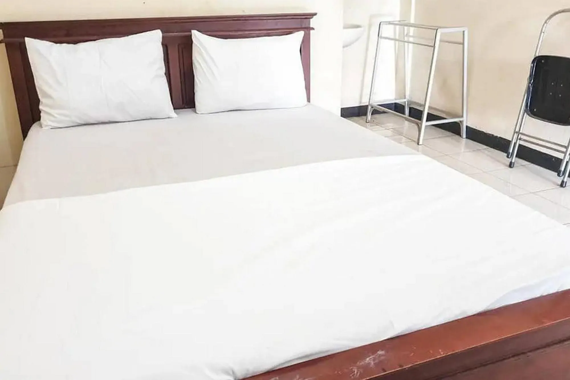 Bed in Penginapan Sinar Harapan near GOR Mastrip Probolinggo