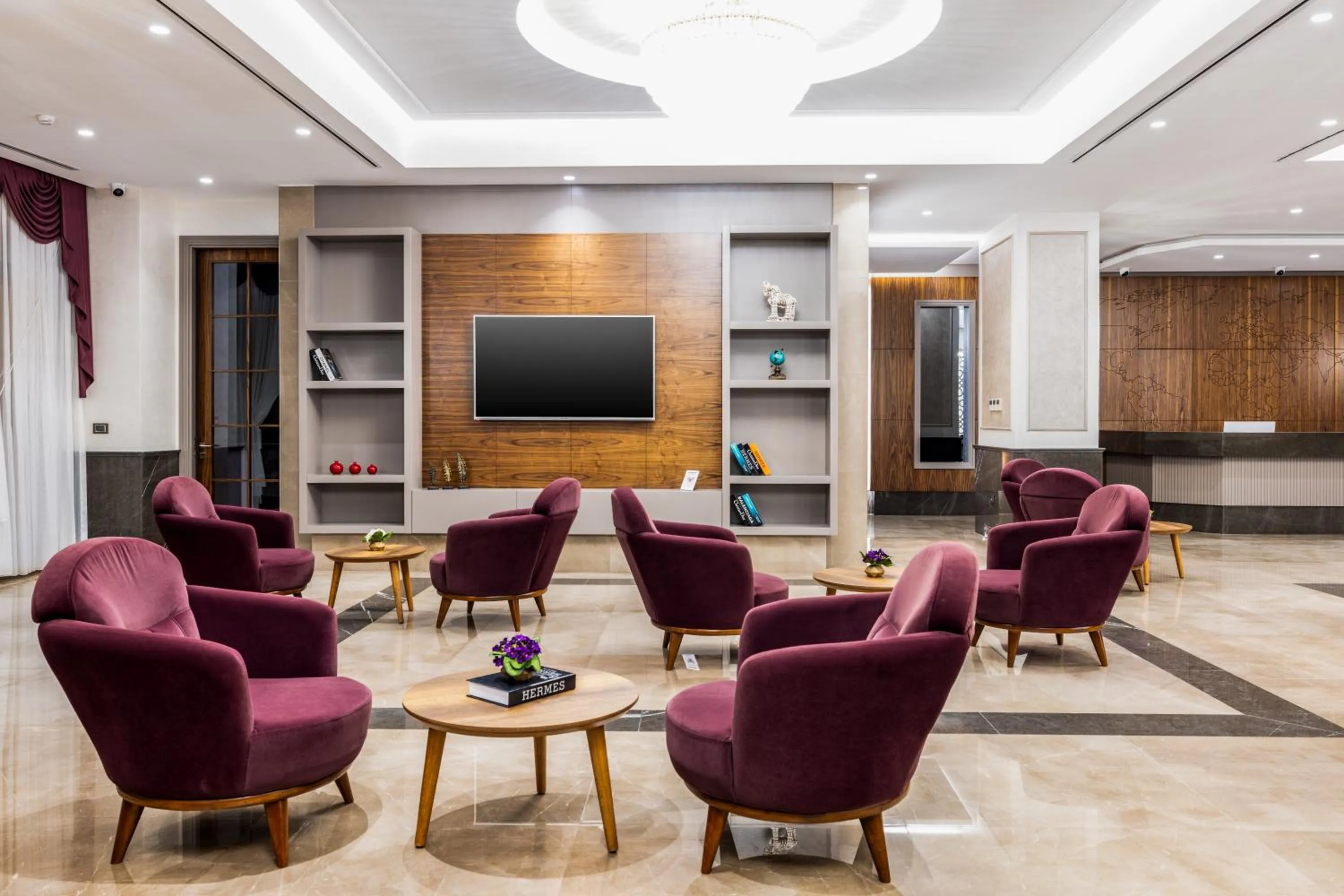Communal lounge/ TV room in Carina Gold Hotel And Restaurant