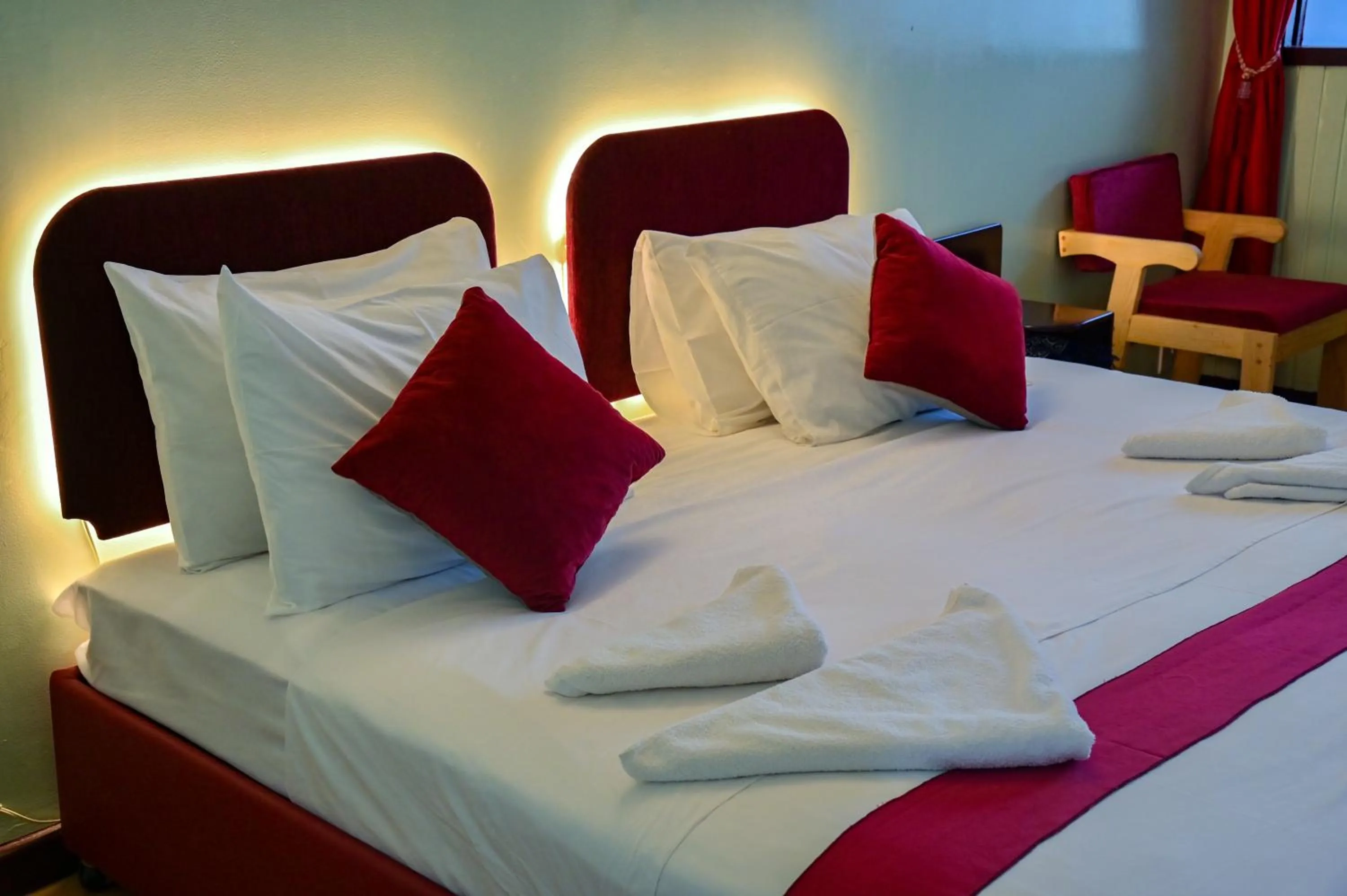 Bed in SIESTA HOTEL