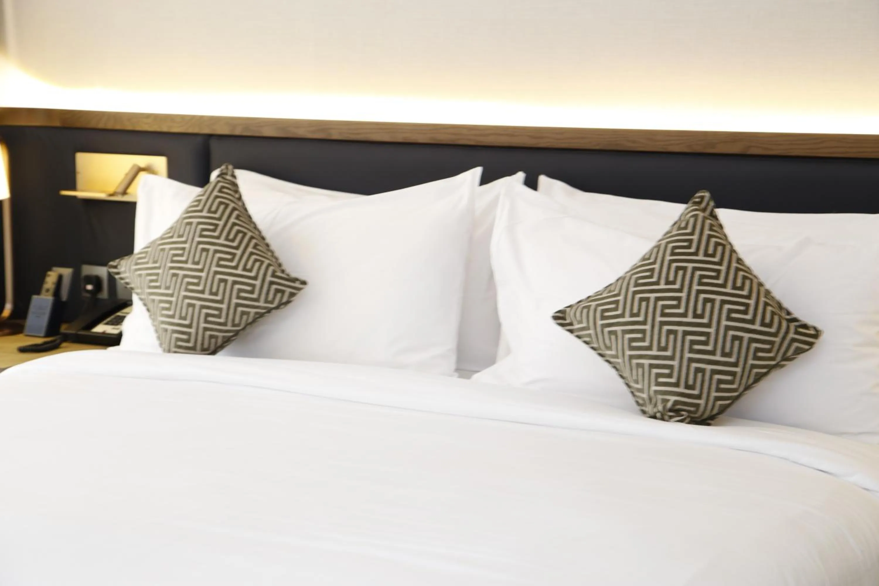 Bed in Nozol Royal Inn Hotel