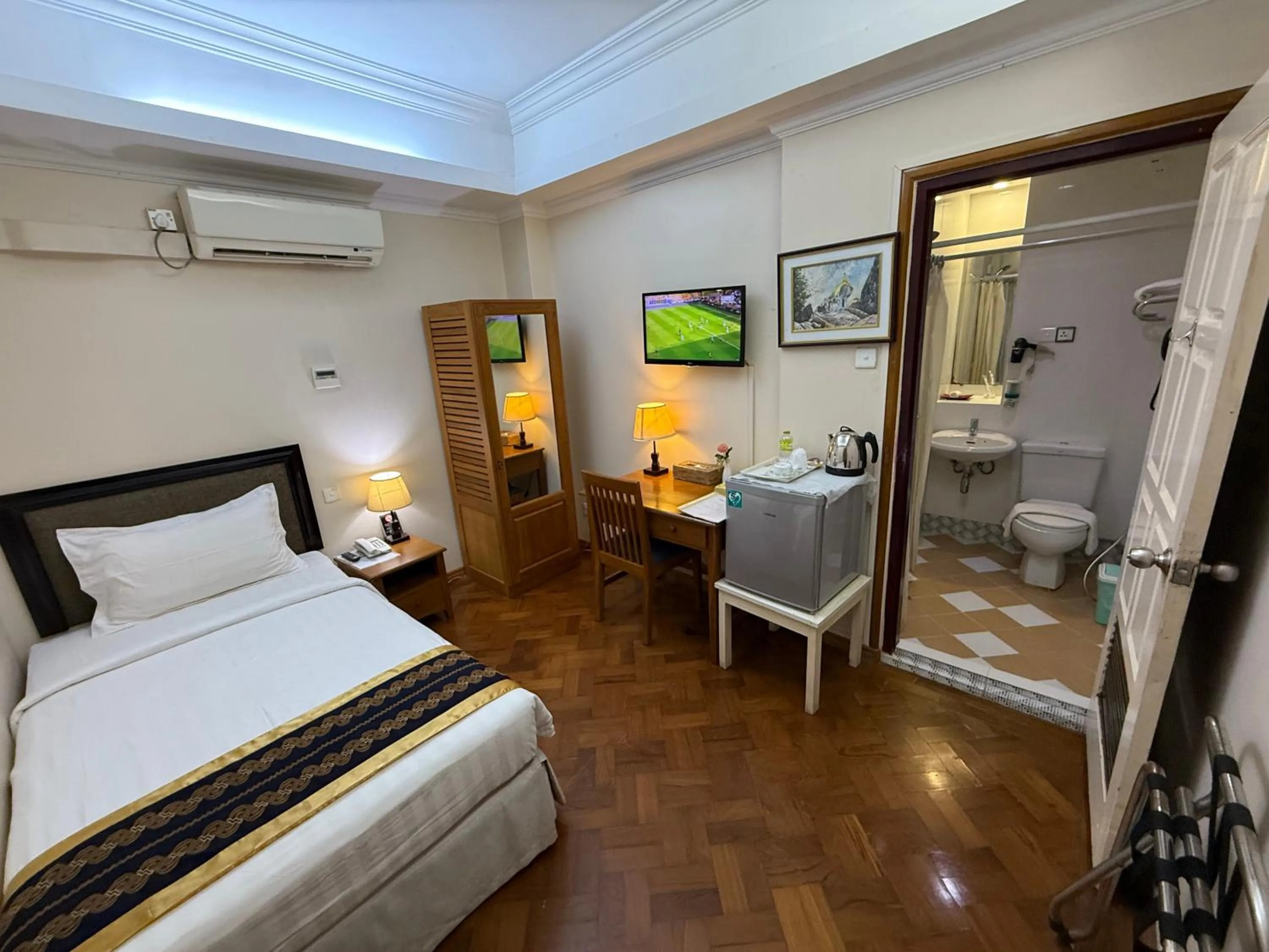 Bed in Grand Laurel Hotel