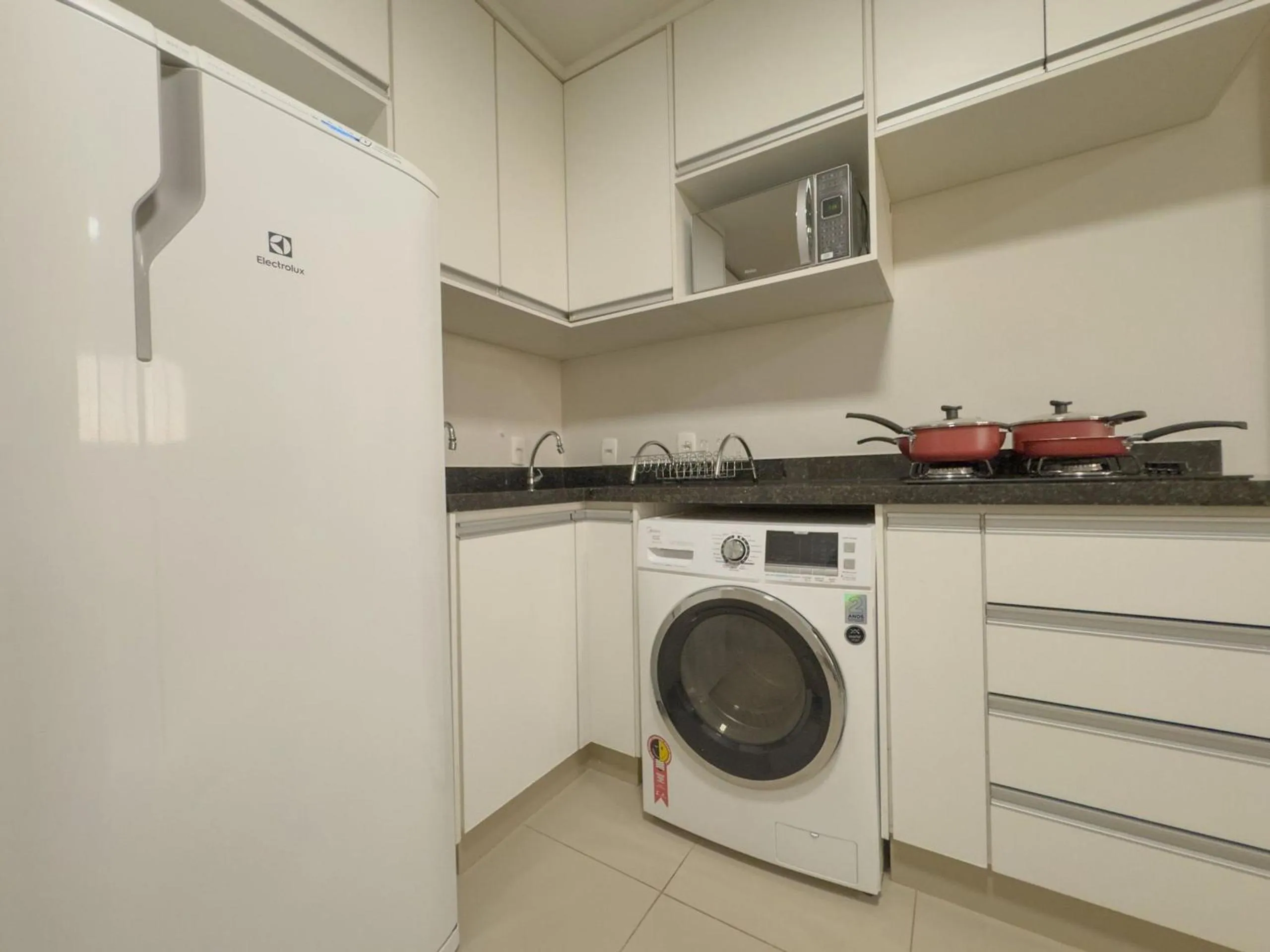 Kitchen or kitchenette in APTOS 1 e 2QTO Lava e Seca e Academia