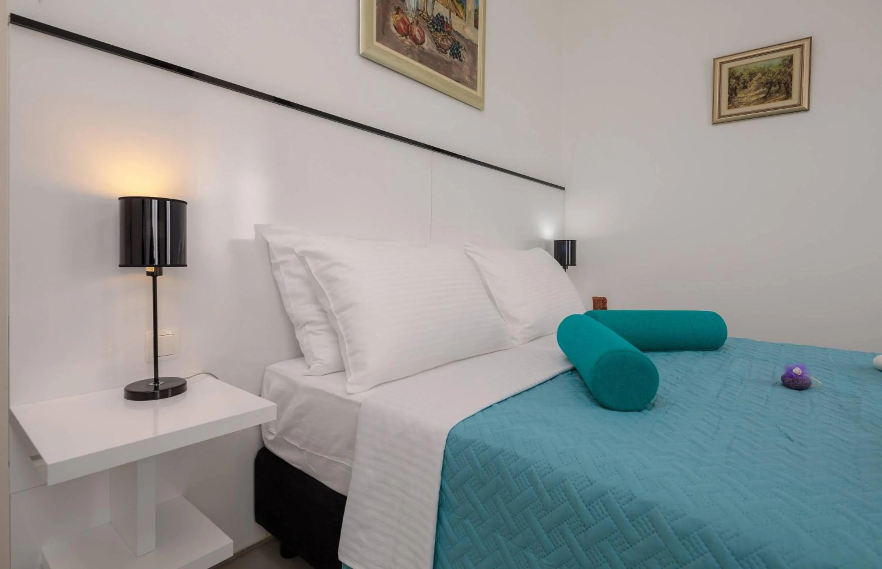 Bed in PLR Luxury Rooms