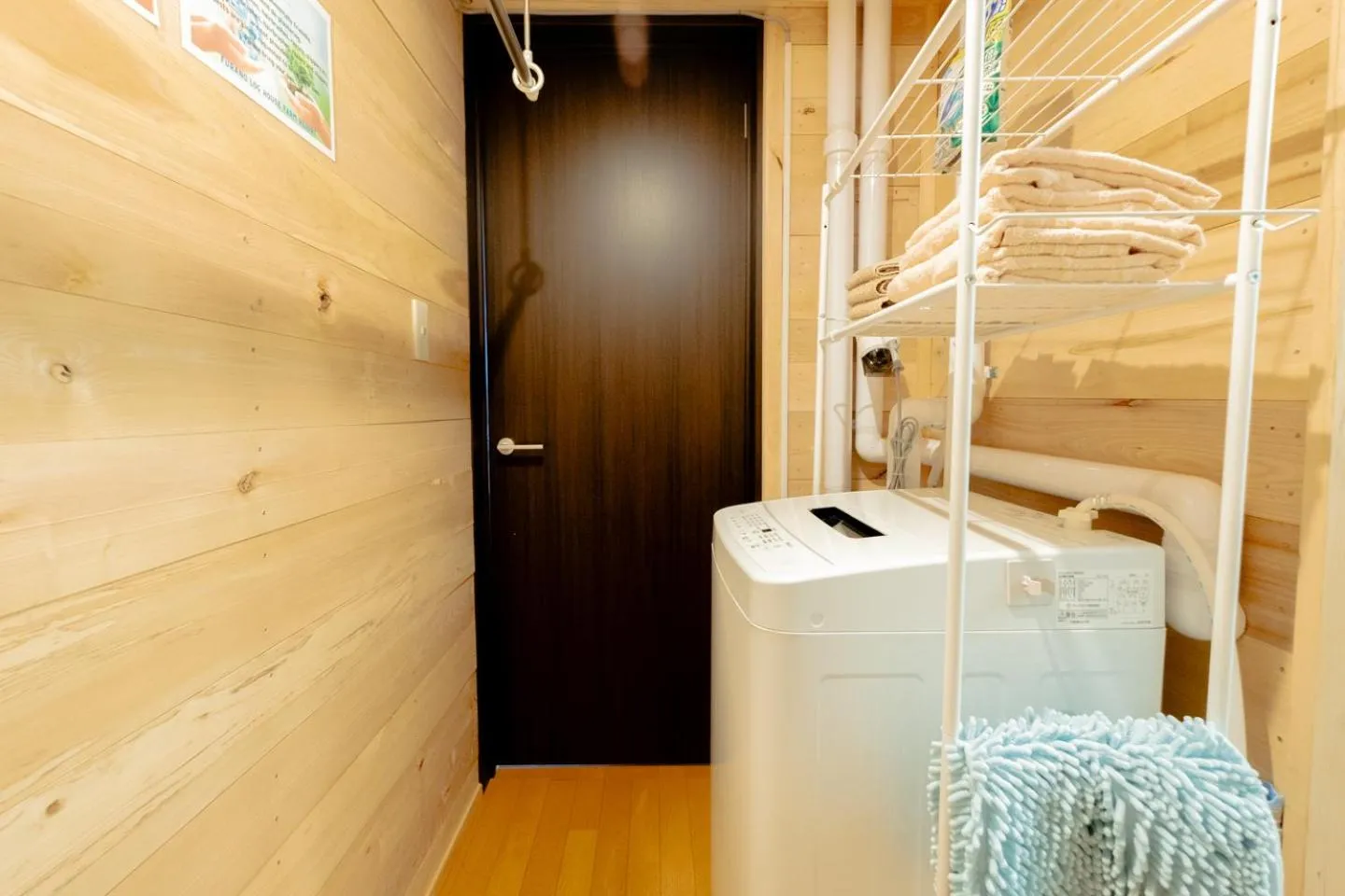 washing machine in Furano Log House Farm Resort