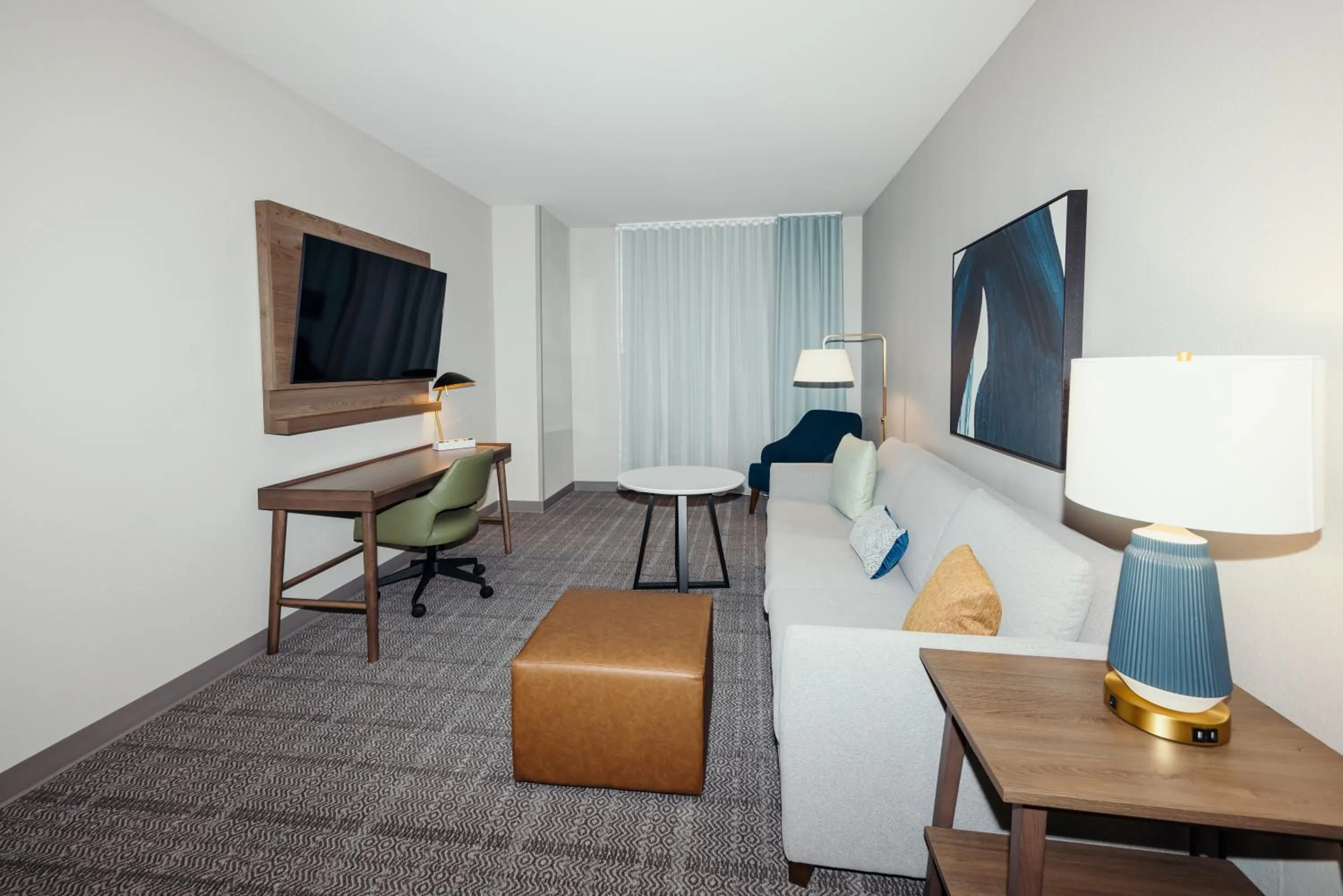 Living room in STAYBRIDGE SUITES Des Moines North - Ankeny by IHG