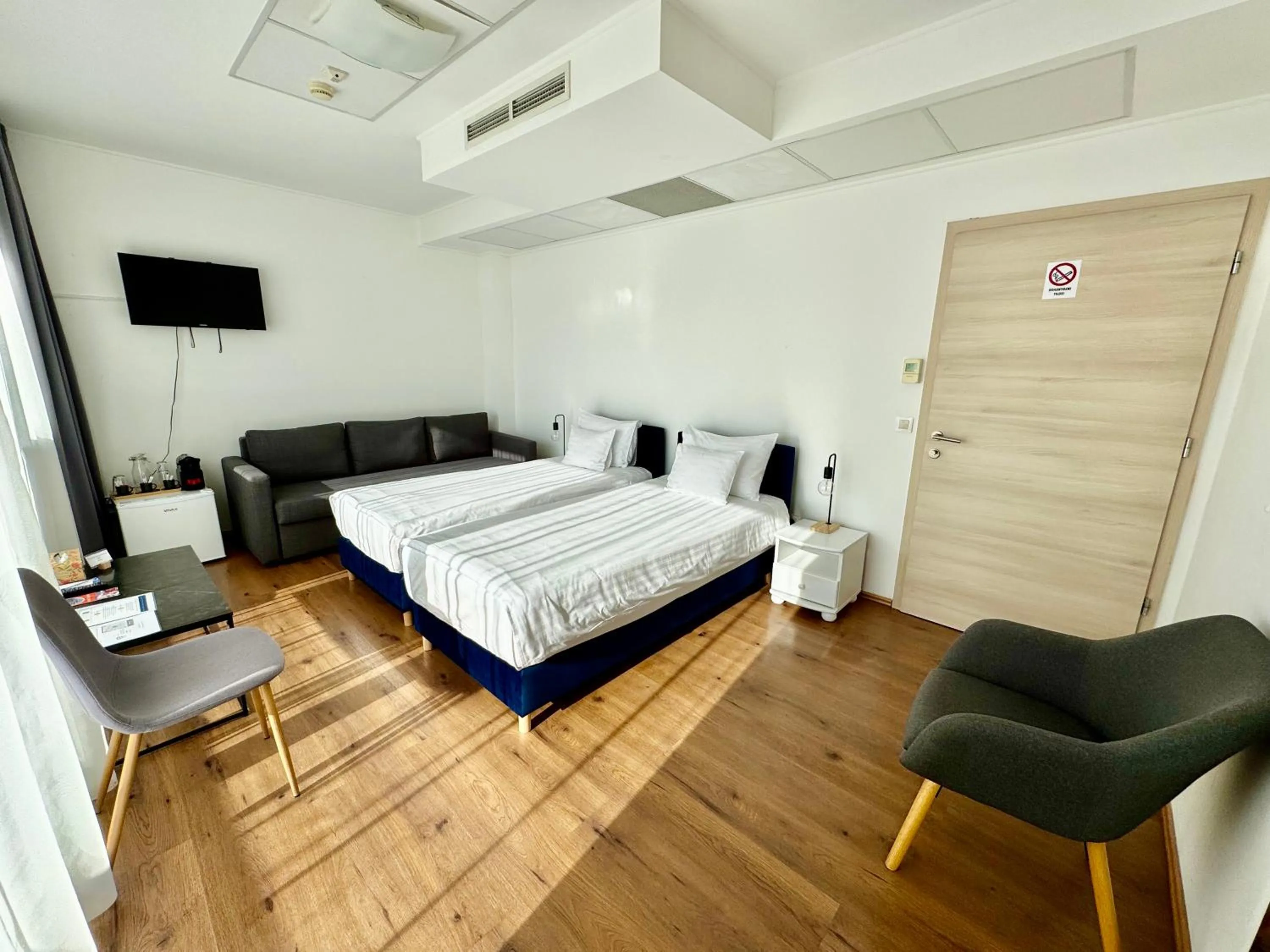 Executive triple room with balcony in Rooftop City Residence