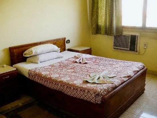 Bed in Memnon Hotel