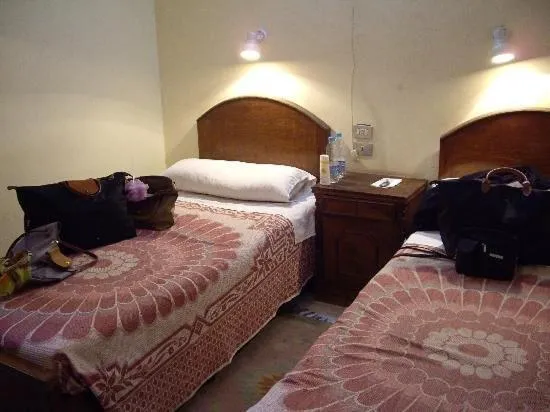 Bed in Memnon Hotel
