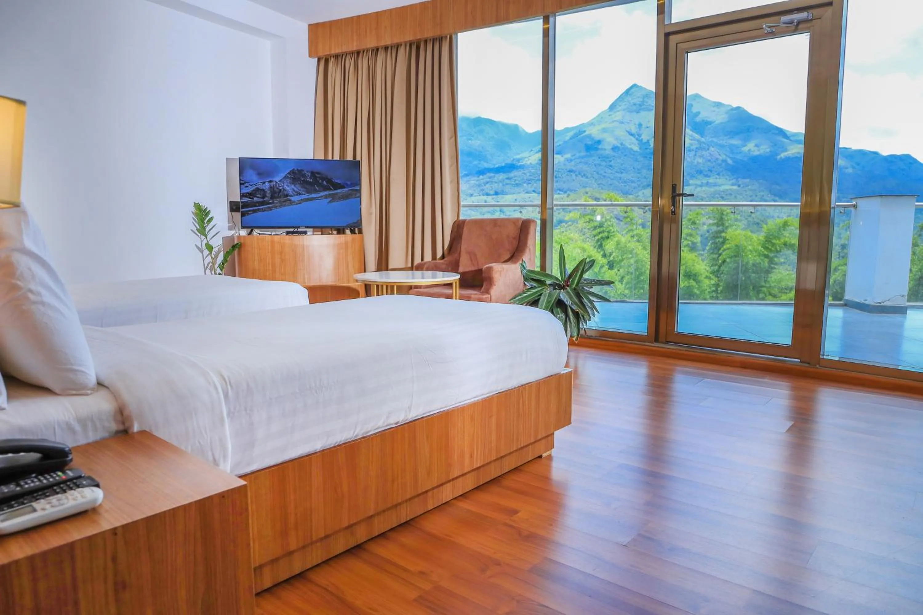 Communal lounge/ TV room, Bed in Hotel Sky Sierra Wayanad