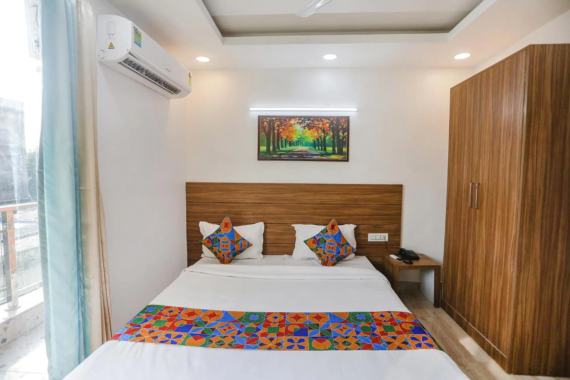 Bed in FabHotel Unique Stay