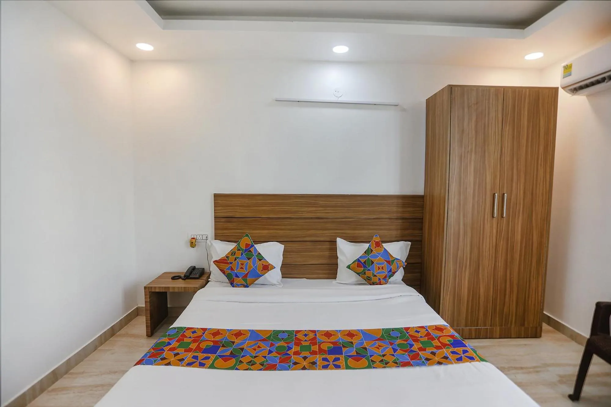 Bed in FabHotel Unique Stay