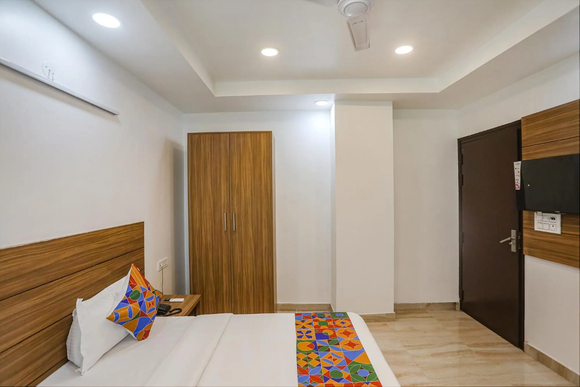 Bed in FabHotel Unique Stay