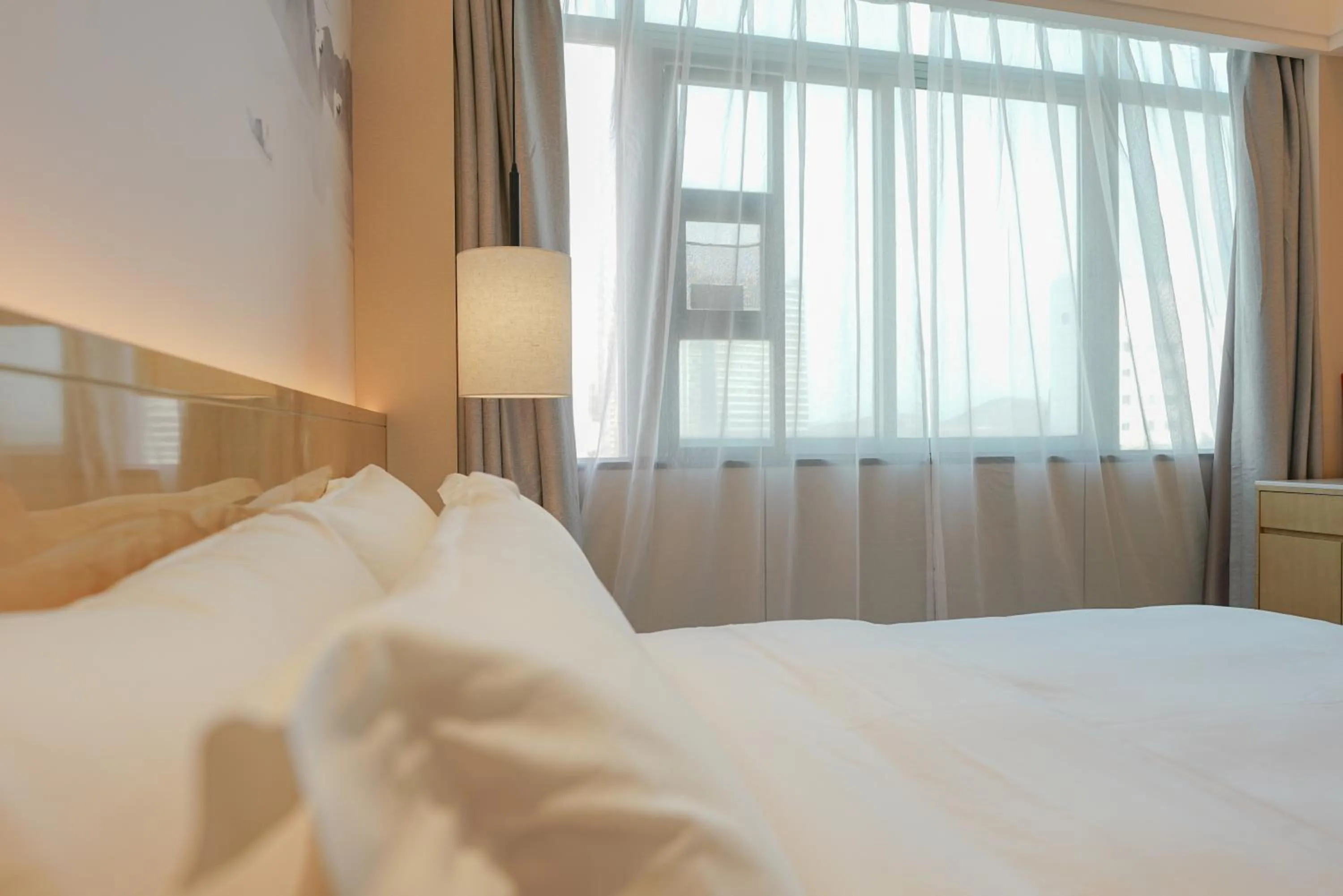 Bed in Paco Hotel Shenzhen Luohu Port