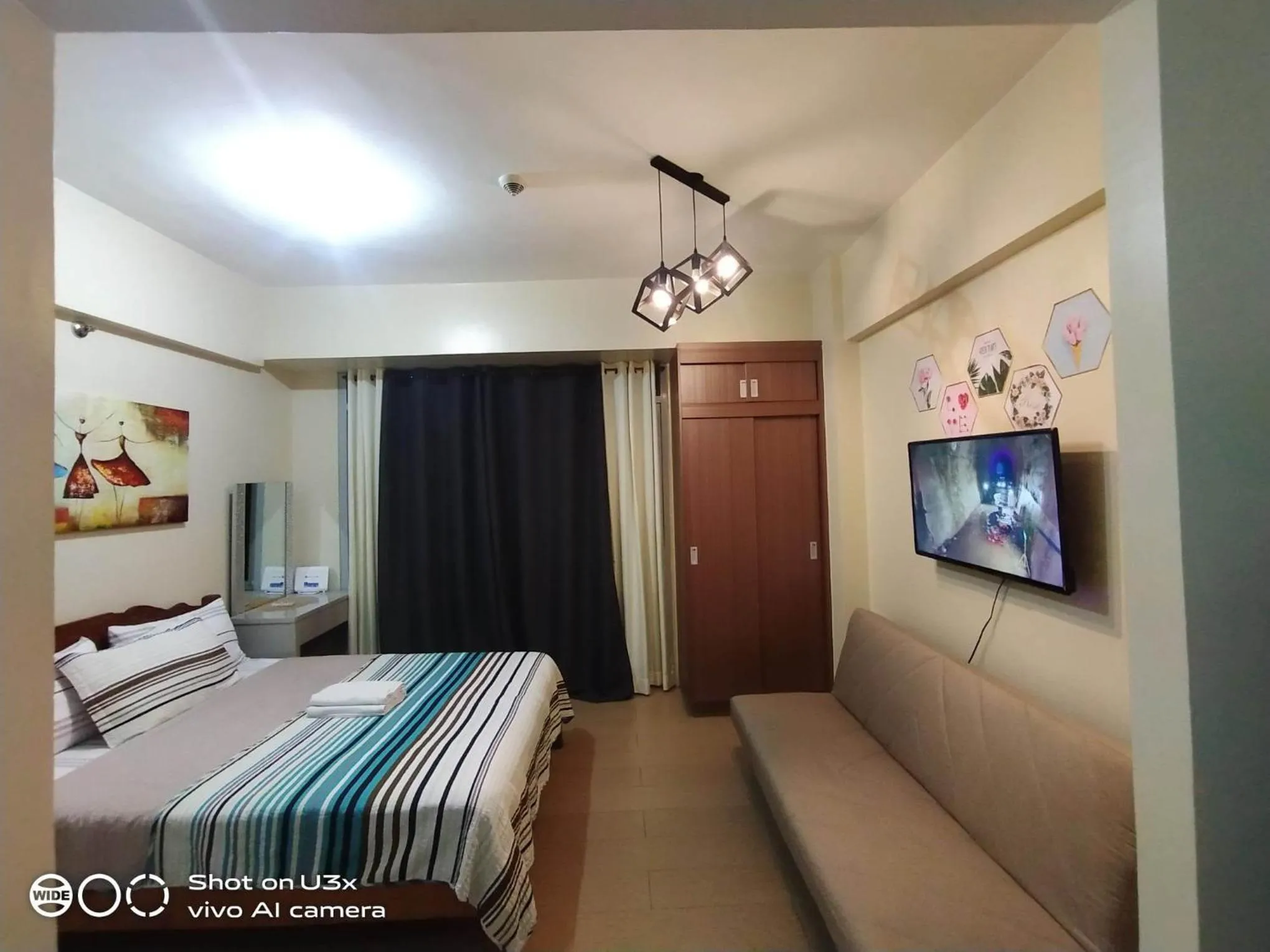 Photo of the whole room, Bed in Pasay Condotel near NAIA terminal 3 (3 mins walk in)