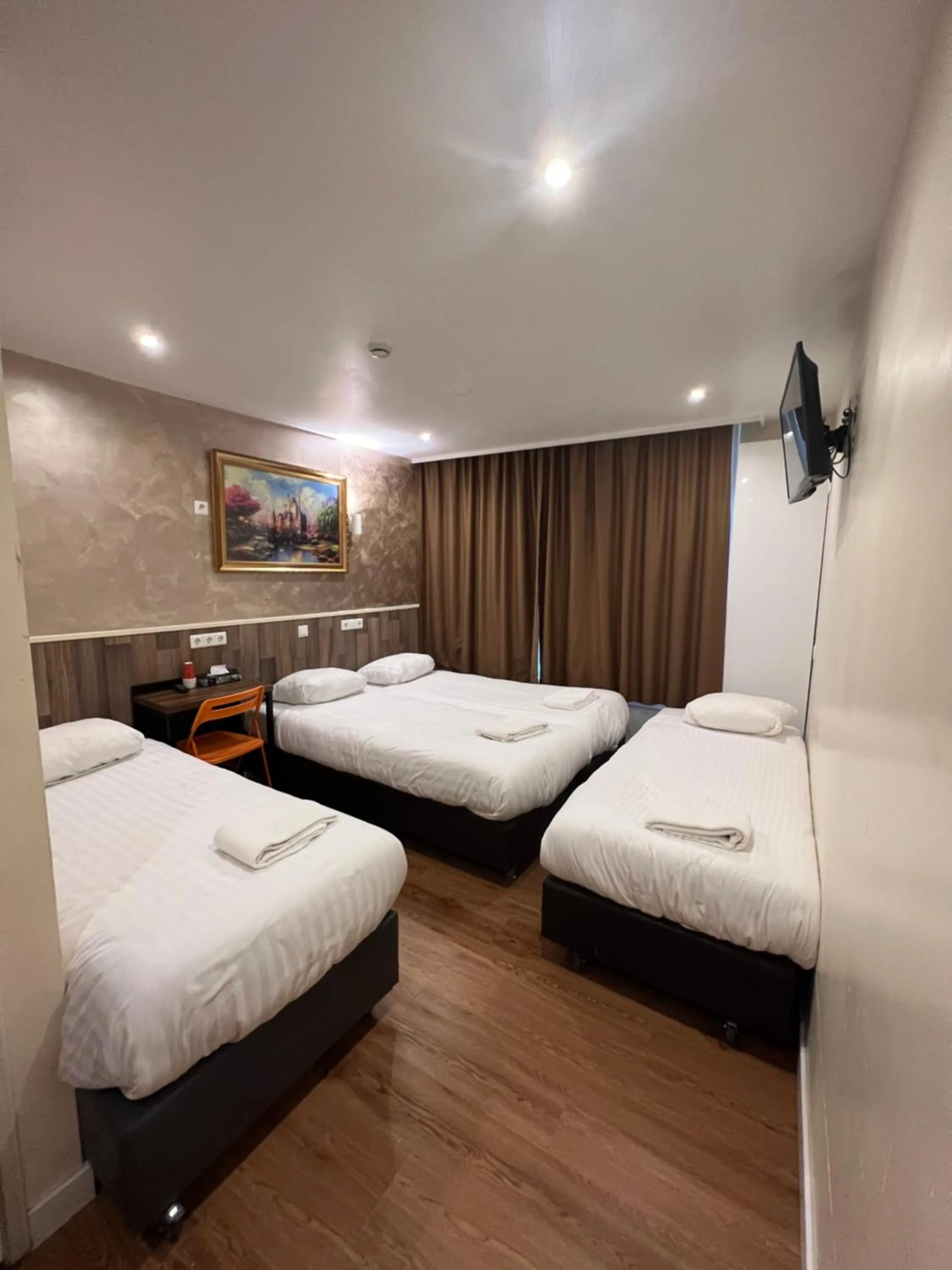 Bed in Orange Tulip Hotel