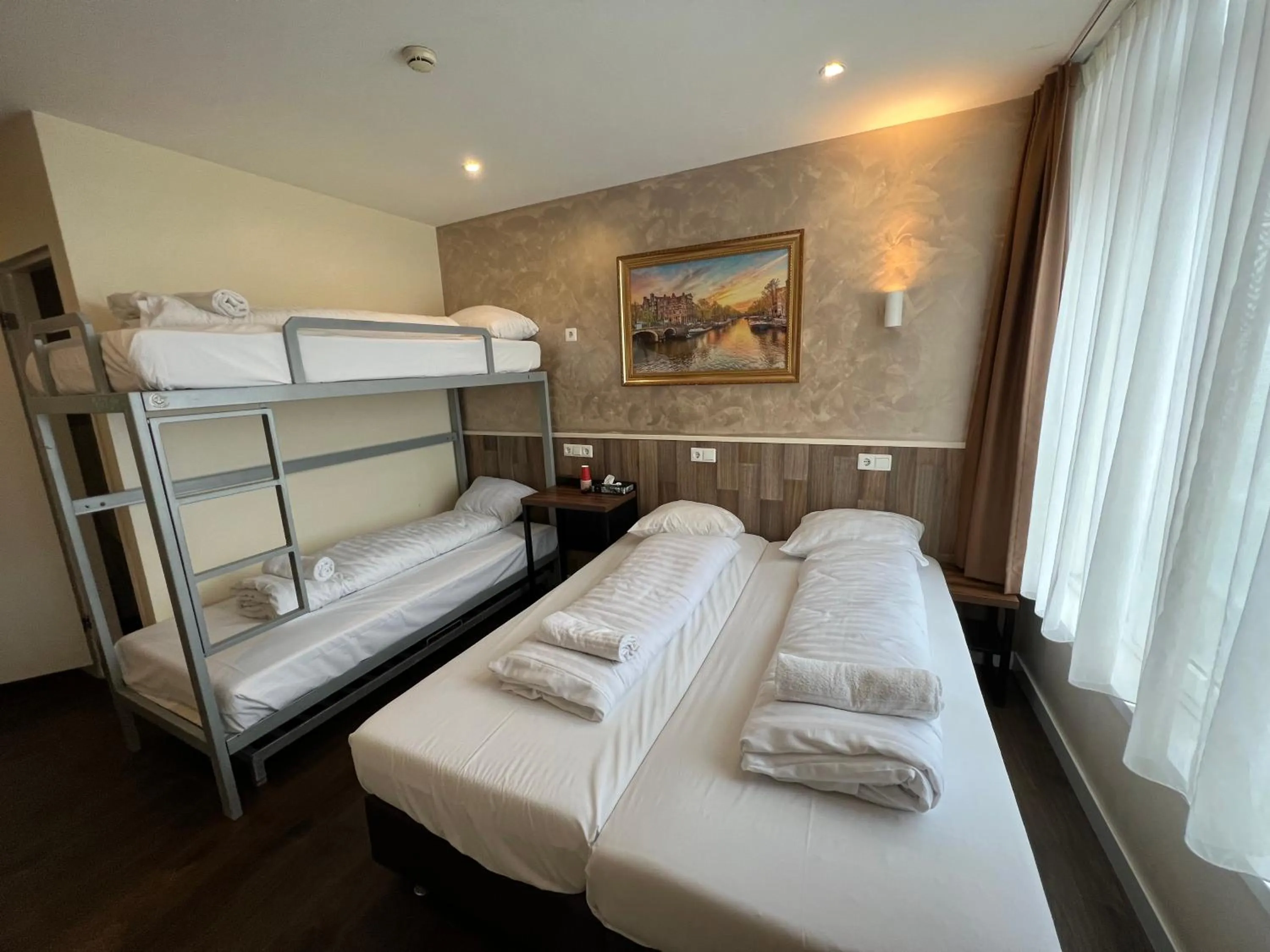 Bed in Orange Tulip Hotel