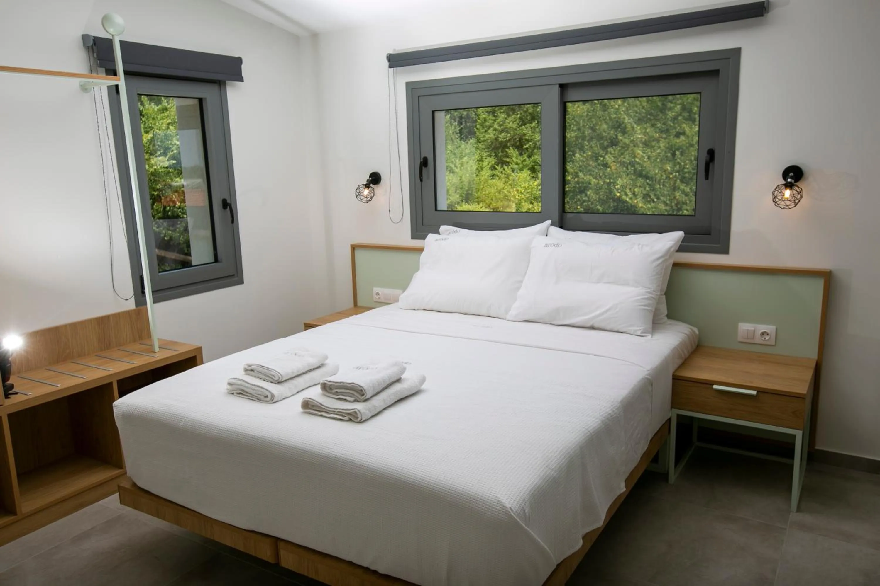 Bed in Arodo Suites