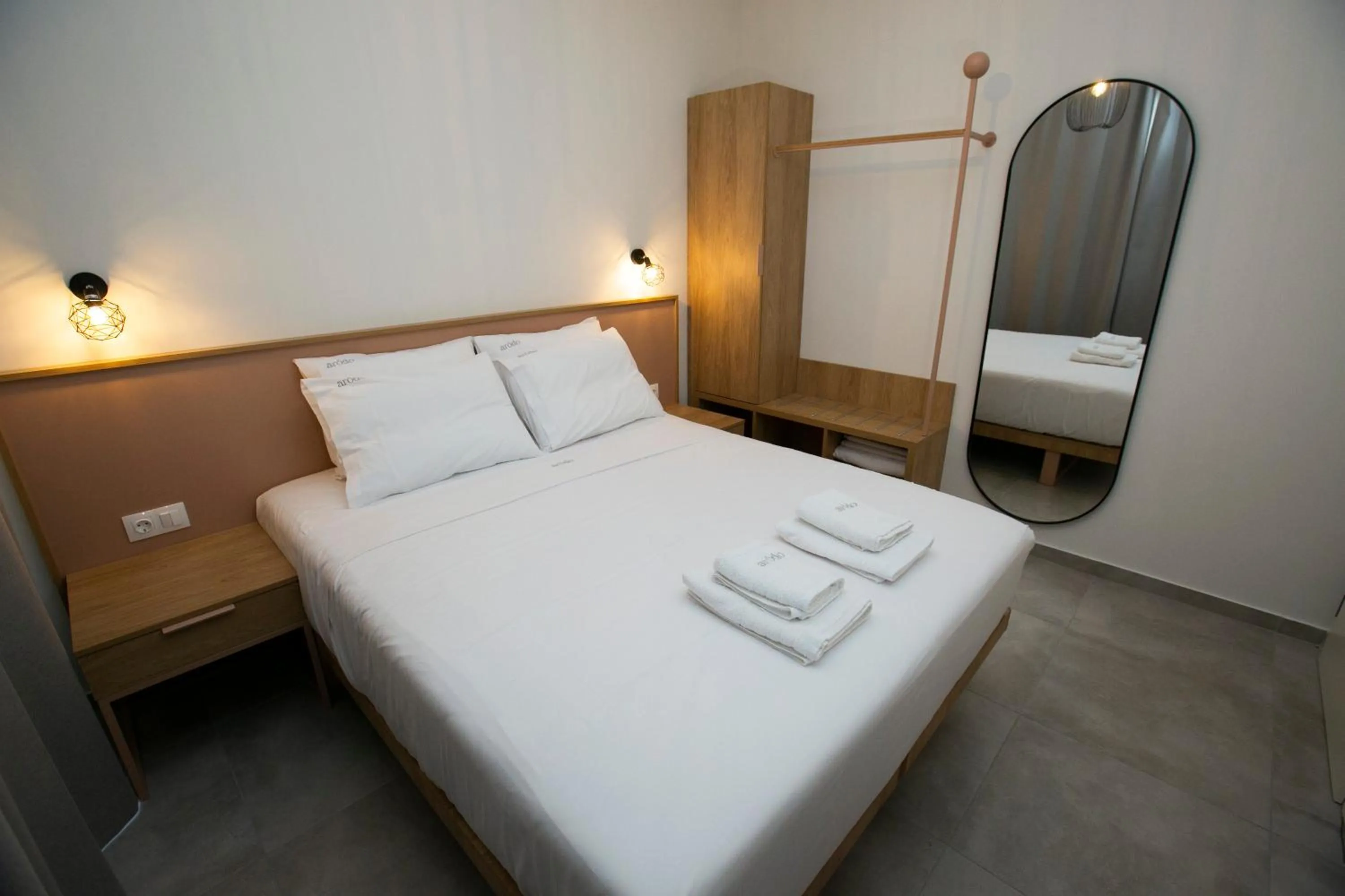 Bed in Arodo Suites