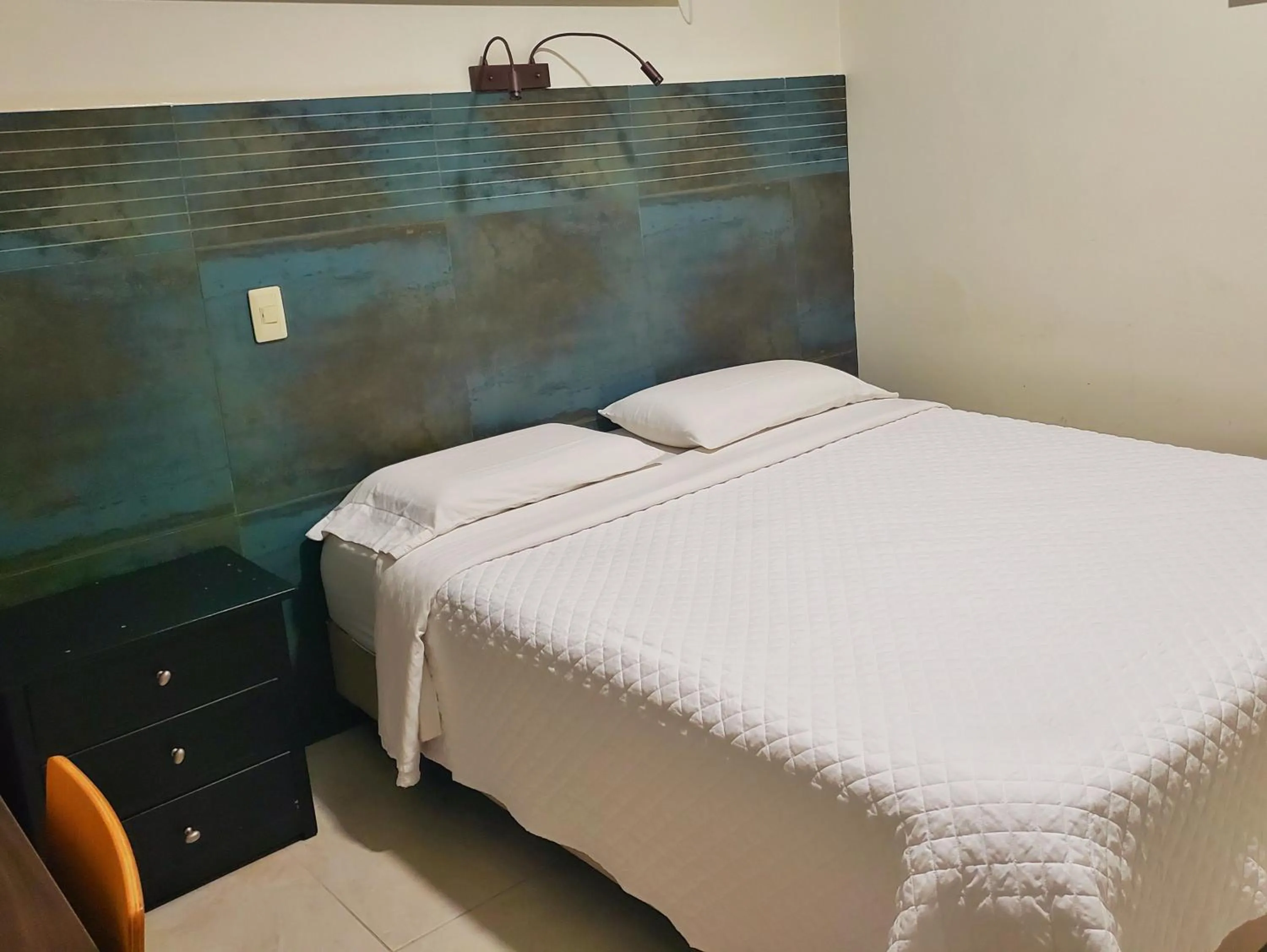 Bed in DC Suites Aeropuerto