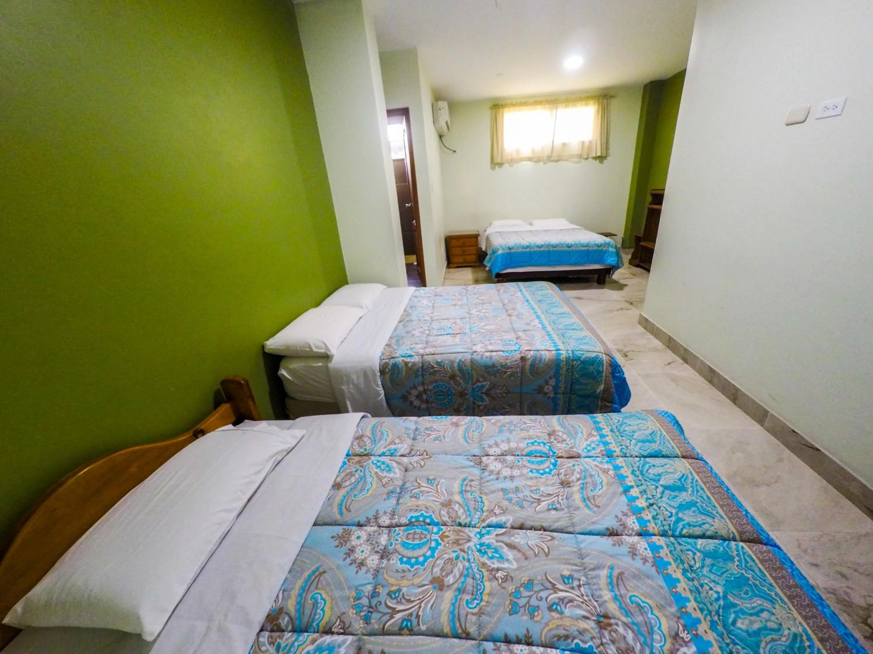 Photo of the whole room, Bed in DC Suites Aeropuerto