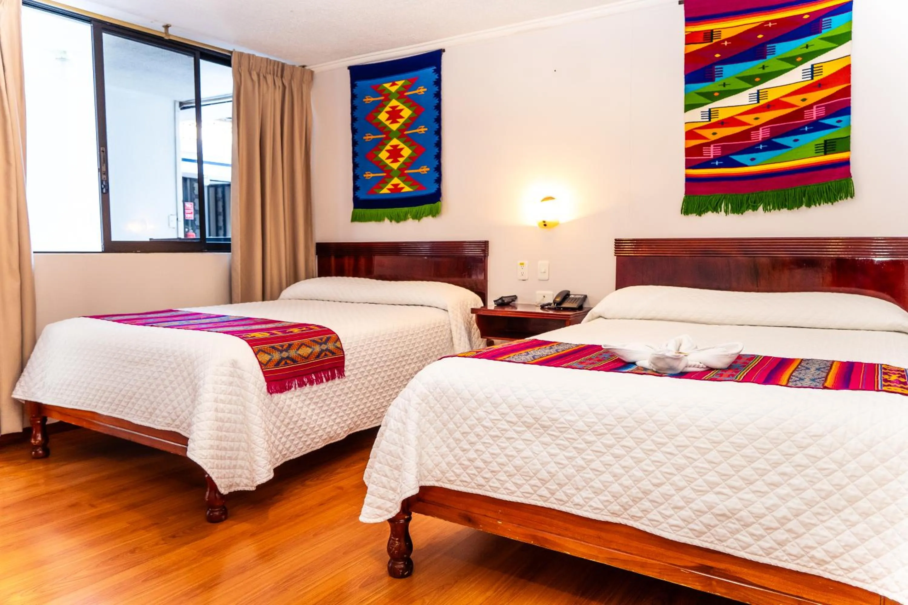 Bed in Hotel El Indio Inn