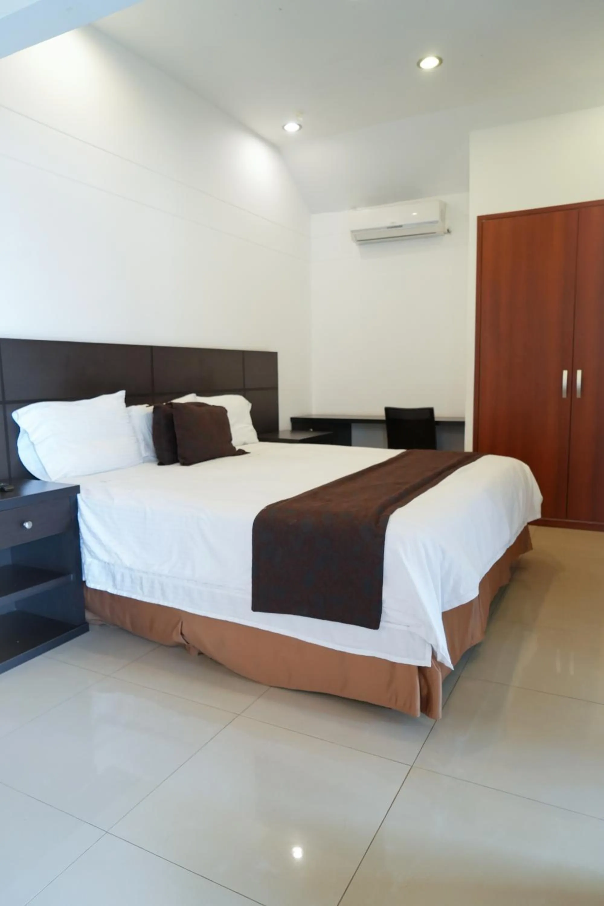 air conditioner, Bed in Serenity Suites Casa Boutique