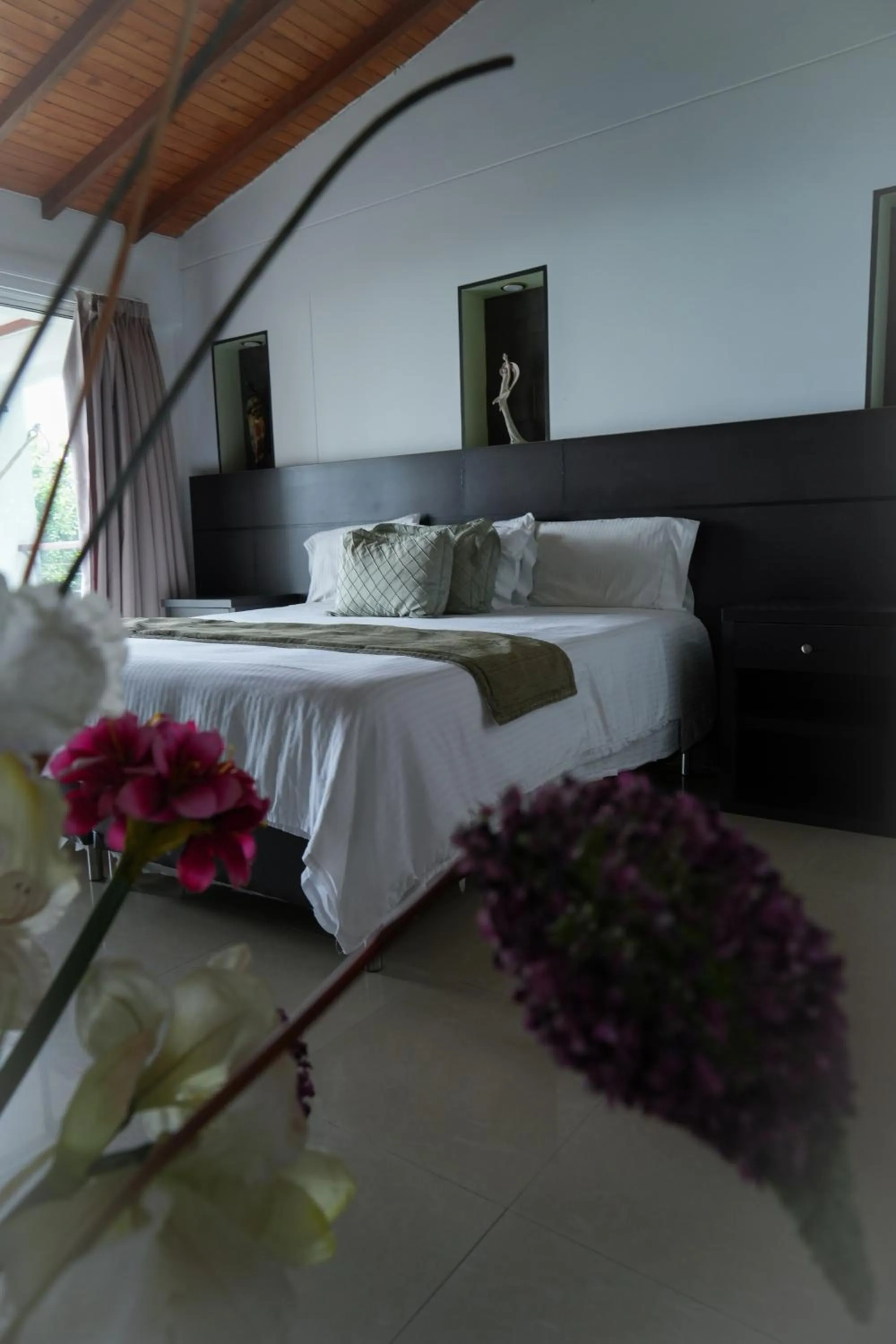 Bed in Serenity Suites Casa Boutique