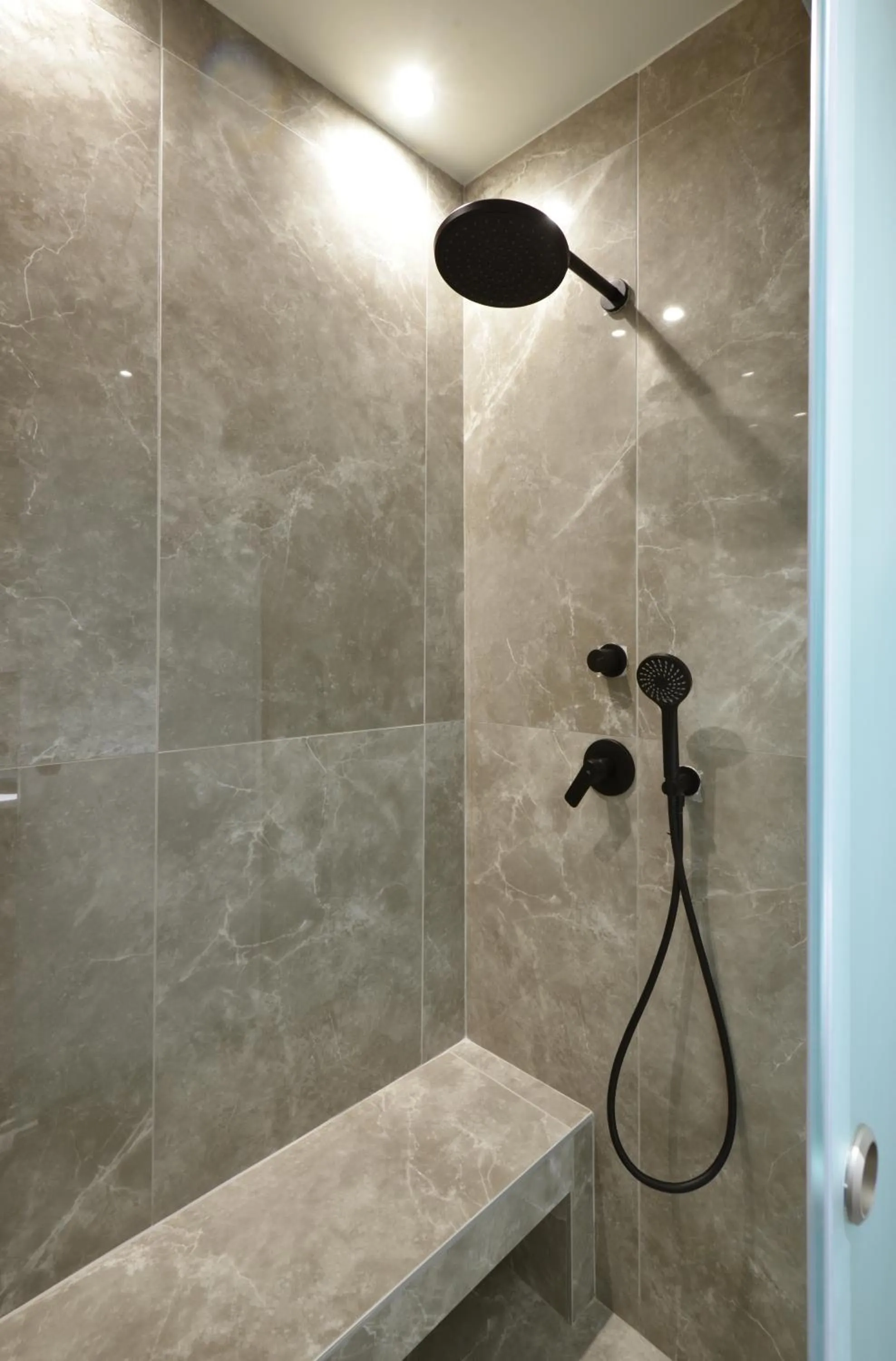Shower in CORYLUS Luxury Rooms & Suites